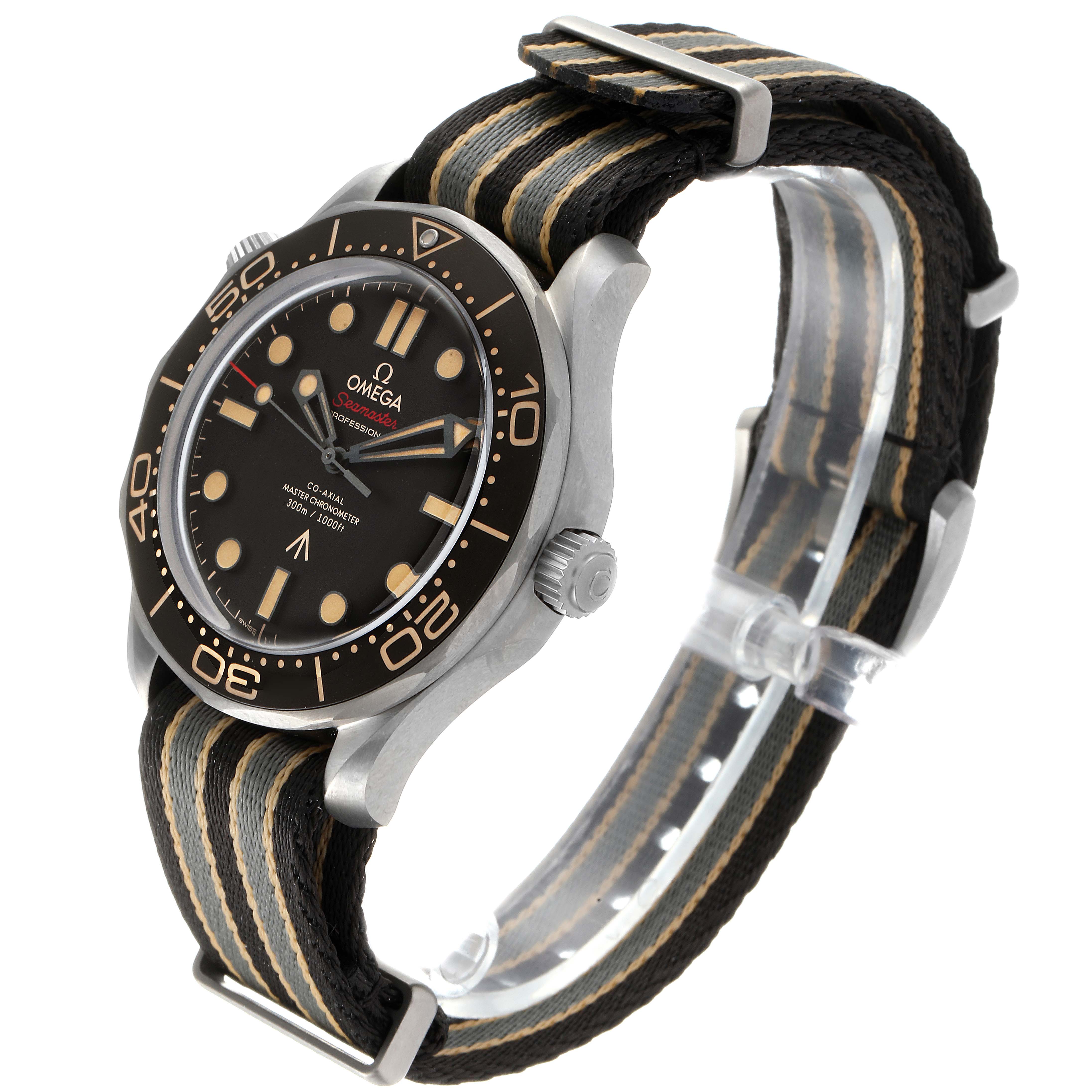 The Omega Seamaster 210.92.42.20.01.001 Men's Titanium Brown Dial 210.92.42.20.01.001 Men's Titanium Brown Dial watch is shown at a three-quarter angle, highlighting its face, bezel, crown, and fabric strap with a buckle.