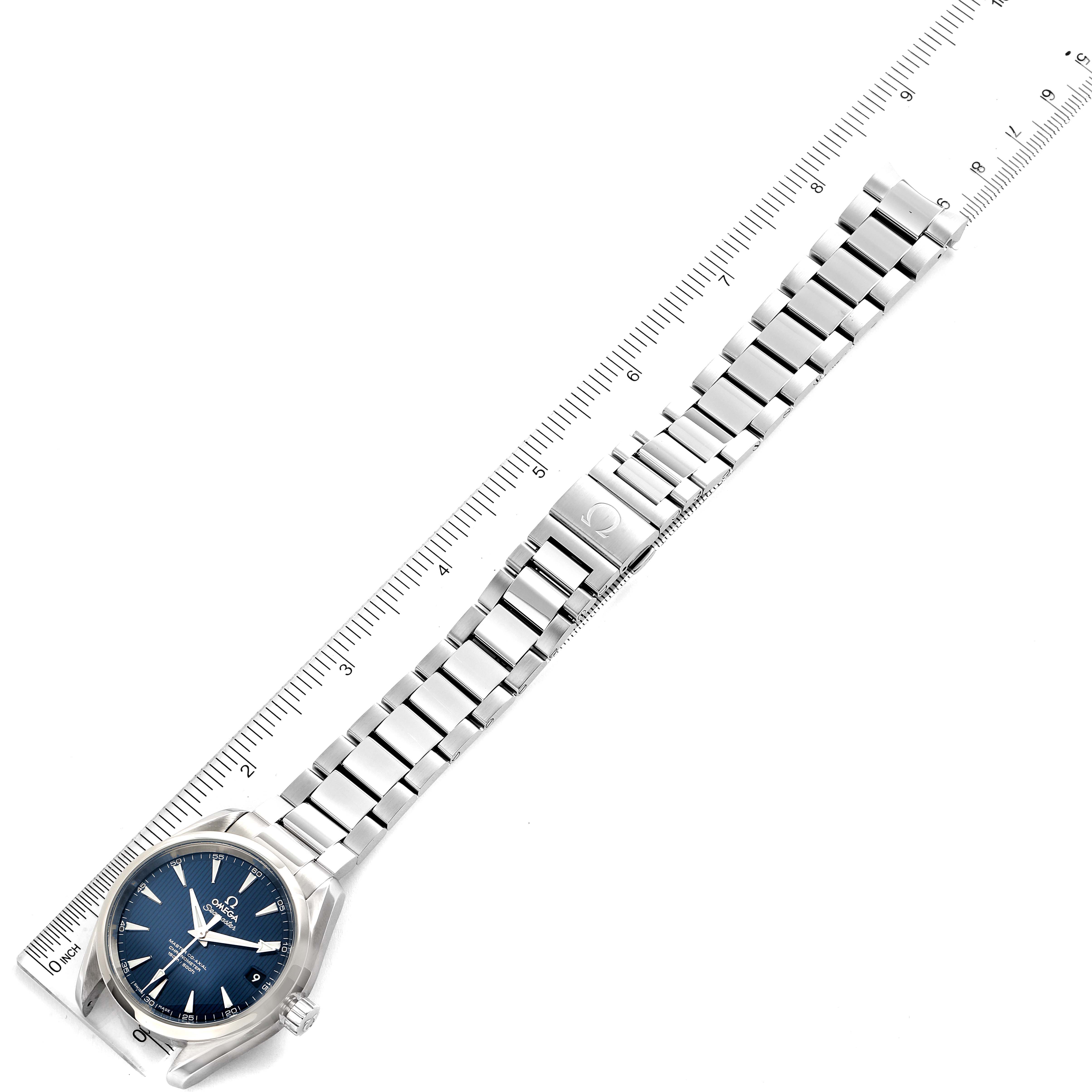 The image shows an Omega Aqua Terra 231.10.39.21.03.002 Men
s Stainless Steel Blue Dial 231.10.39.21.03.002 Men
s Stainless Steel Blue Dial watch laid flat next to a ruler, displaying its face, bezel, bracelet, and clasp.