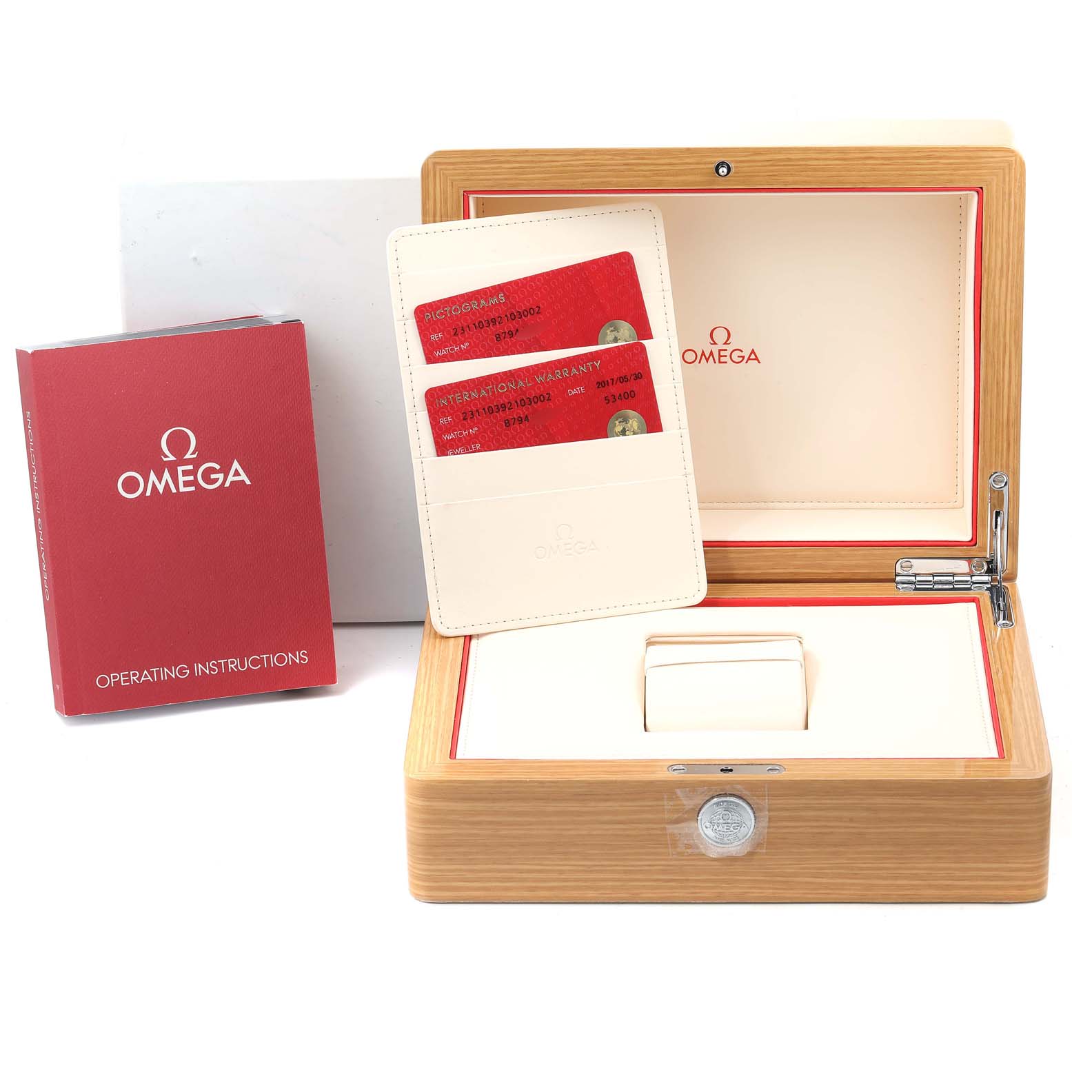 The image shows the Aqua Terra model by Omega
s packaging, including the watch box, warranty cards, and operating instructions.