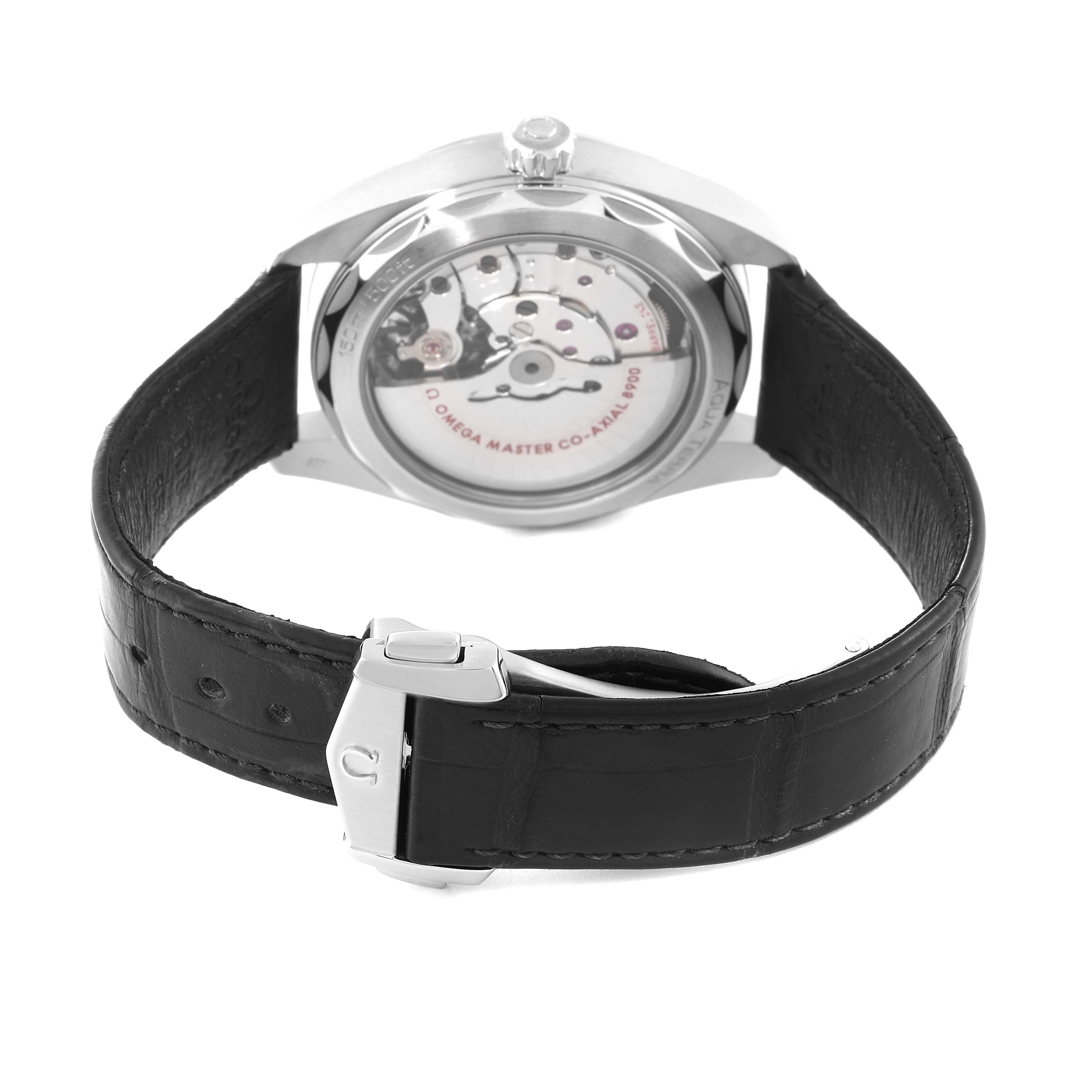 The image shows the back view of an Omega Aqua Terra 220.13.41.21.03.001 Men's Stainless Steel Blue Dial 220.13.41.21.03.001 Men's Stainless Steel Blue Dial watch, highlighting its mechanism and leather strap.