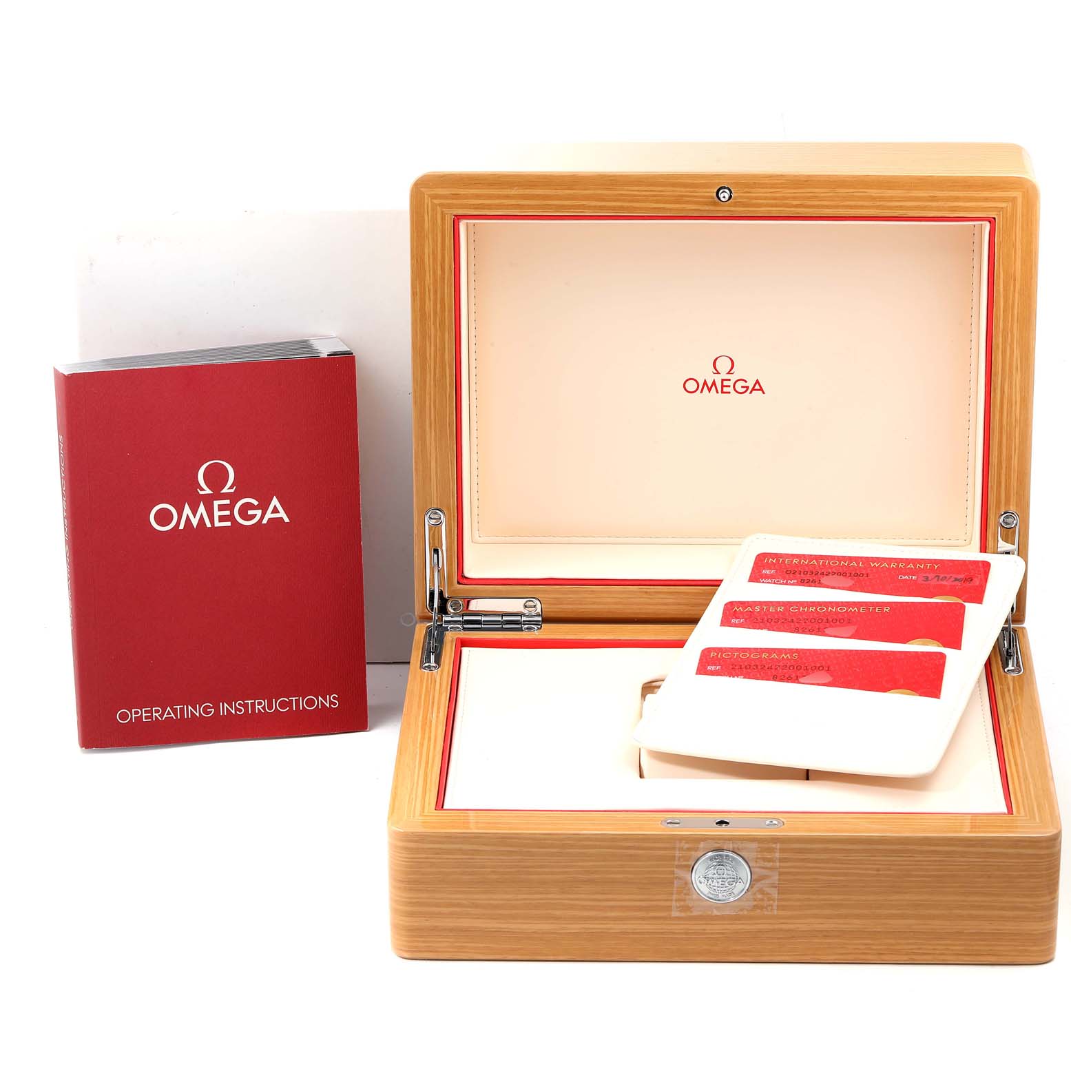 The image shows an Omega Seamaster 210.32.42.20.01.001 Men's Stainless Steel Black Dial 210.32.42.20.01.001 Men's Stainless Steel Black Dial watch's wooden box, international warranty cards, and operating instructions on a flat surface.