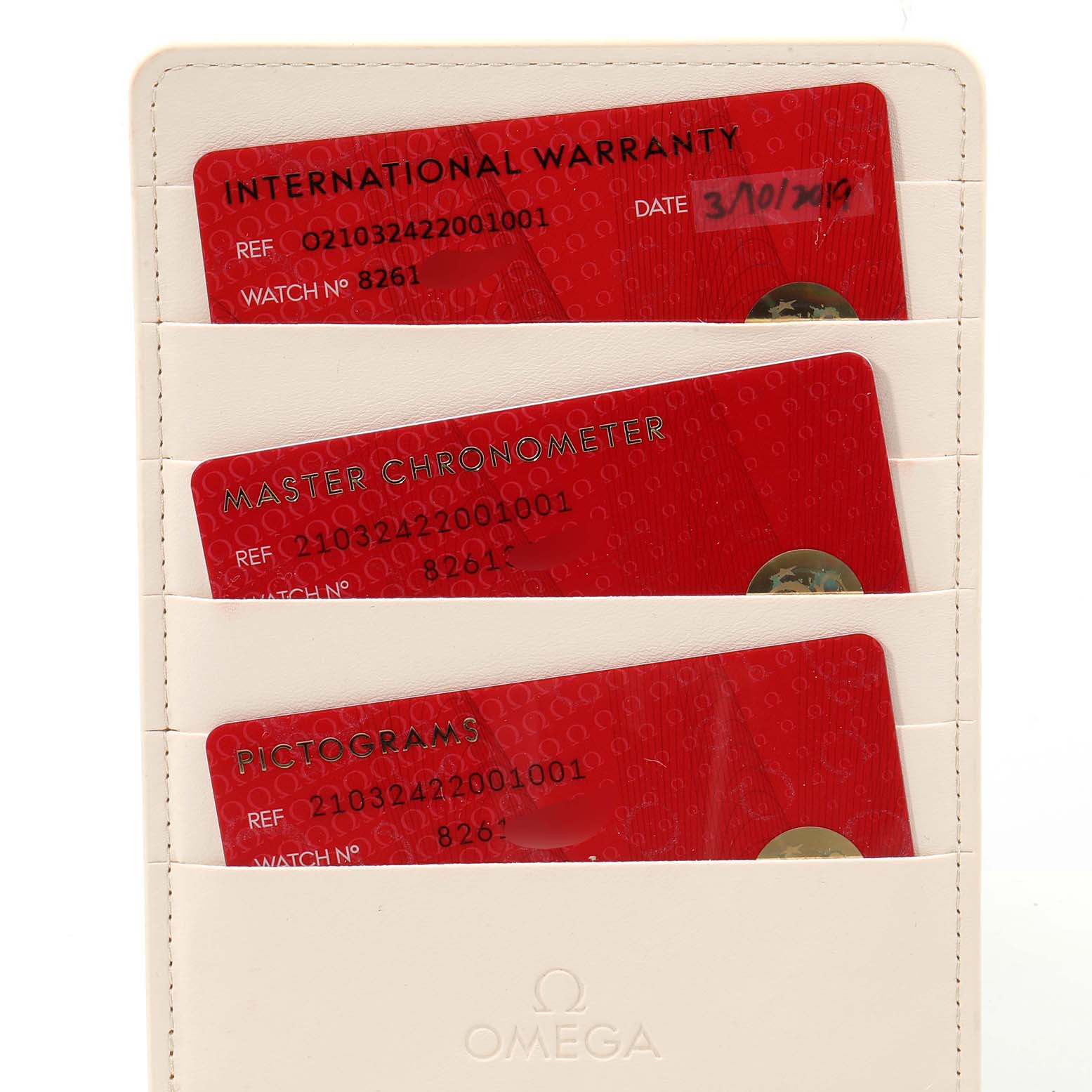 The image shows the warranty cards and certificates for the Omega Seamaster 210.32.42.20.01.001 Men's Stainless Steel Black Dial 210.32.42.20.01.001 Men's Stainless Steel Black Dial watch, placed in a white cardholder.