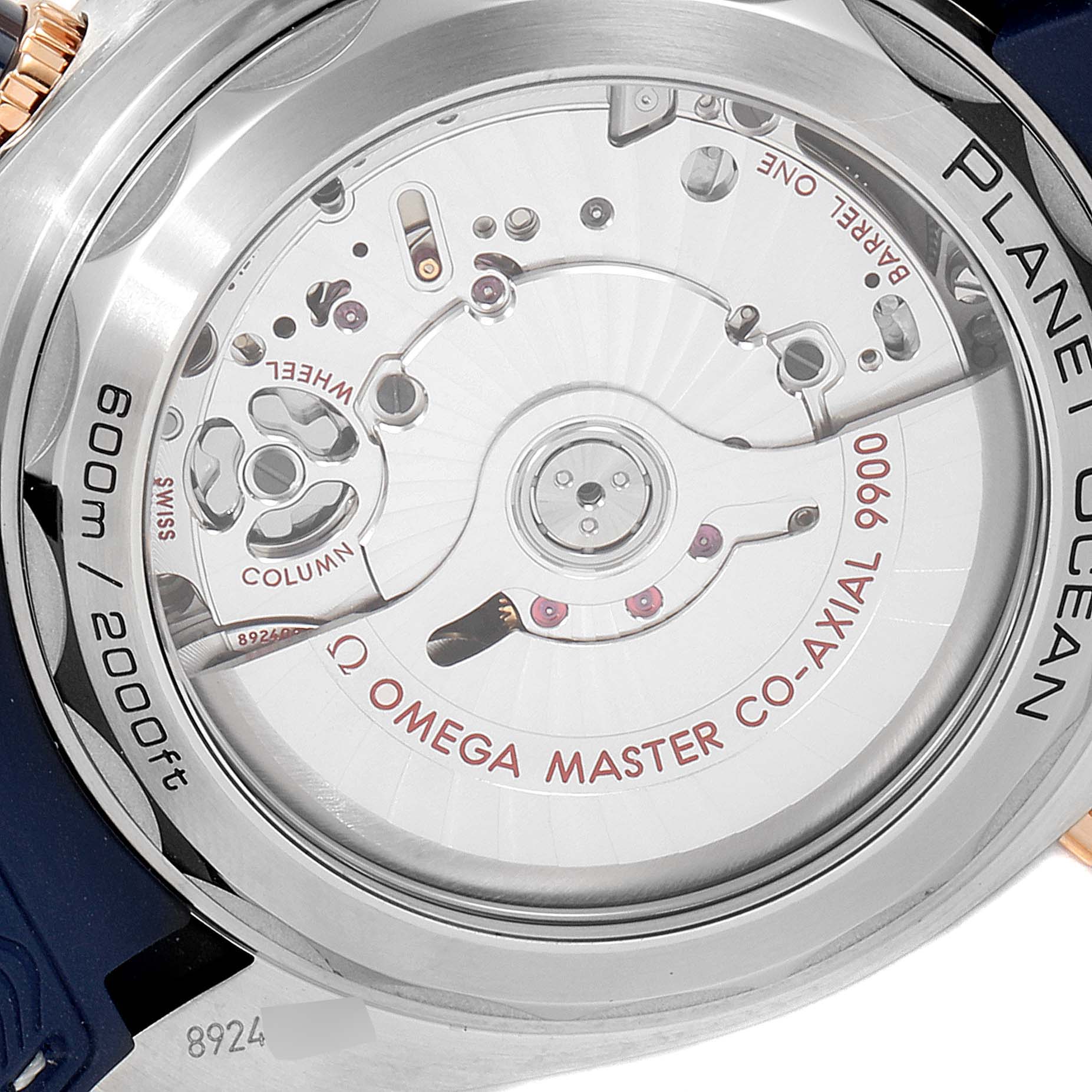 This image shows the back of the Omega Planet Ocean 215.23.46.51.03.001 Men's Steel and Gold (two tone) Blue Dial 215.23.46.51.03.001 Men's Steel and Gold (two tone) Blue Dial watch, highlighting the Omega Master Co-Axial 9900 movement.