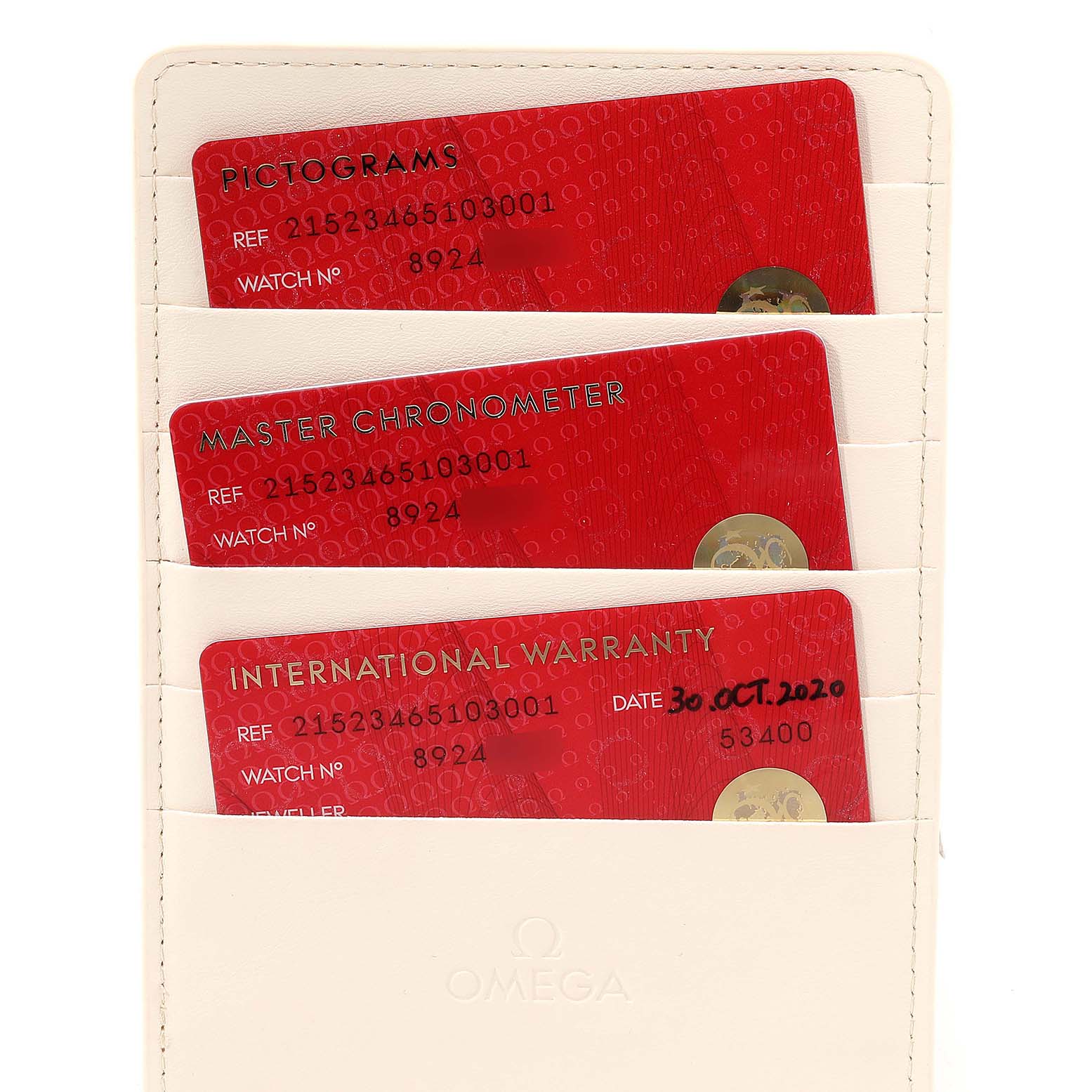 The image shows three red cards related to an Omega Planet Ocean 215.23.46.51.03.001 Men's Steel and Gold (two tone) Blue Dial 215.23.46.51.03.001 Men's Steel and Gold (two tone) Blue Dial watch: Pictograms, Master Chronometer, and International Warranty.