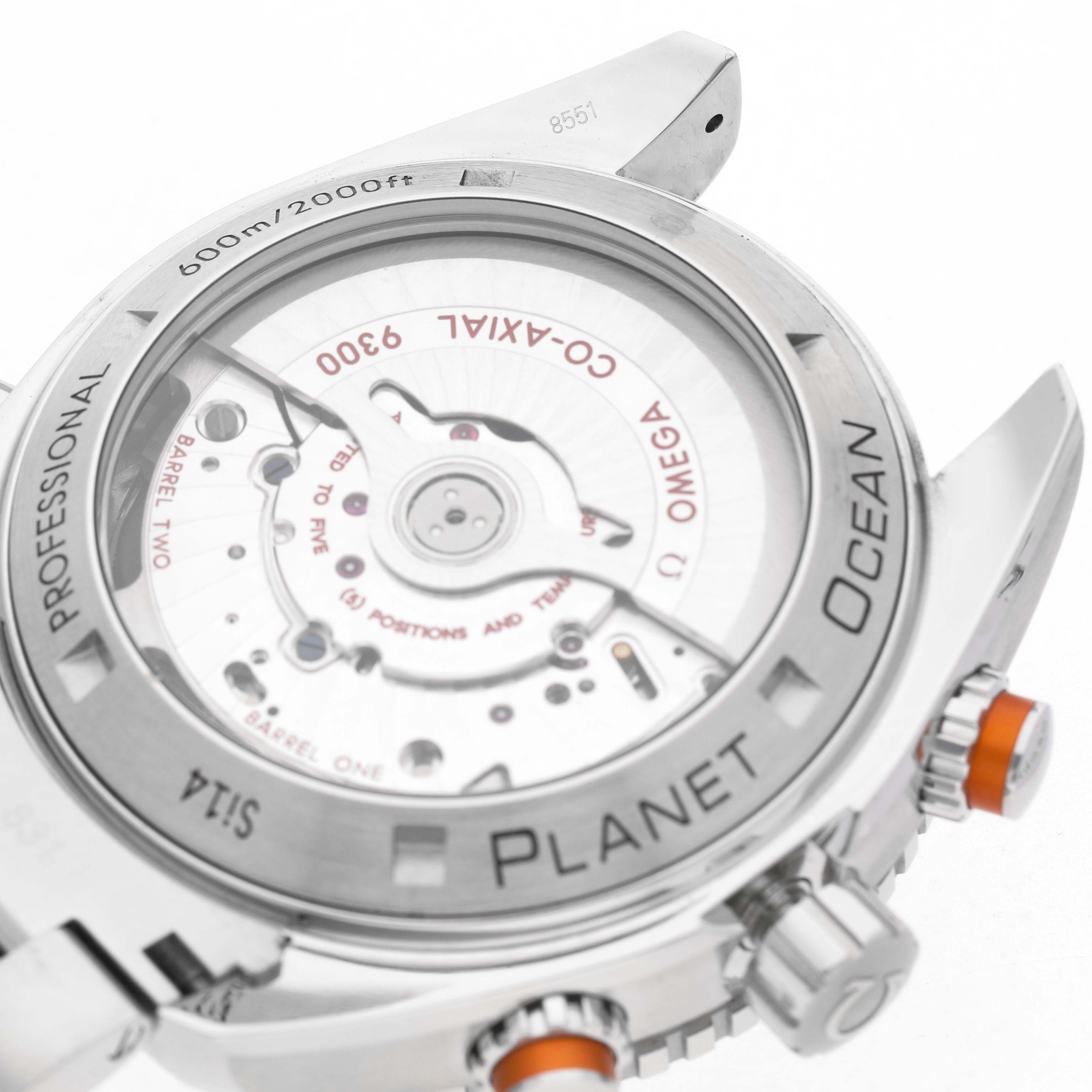 The image shows the back view of the Omega Planet Ocean 232.30.46.51.01.002 Men's Stainless Steel Black Dial watch, highlighting the transparent case back and inner mechanism.