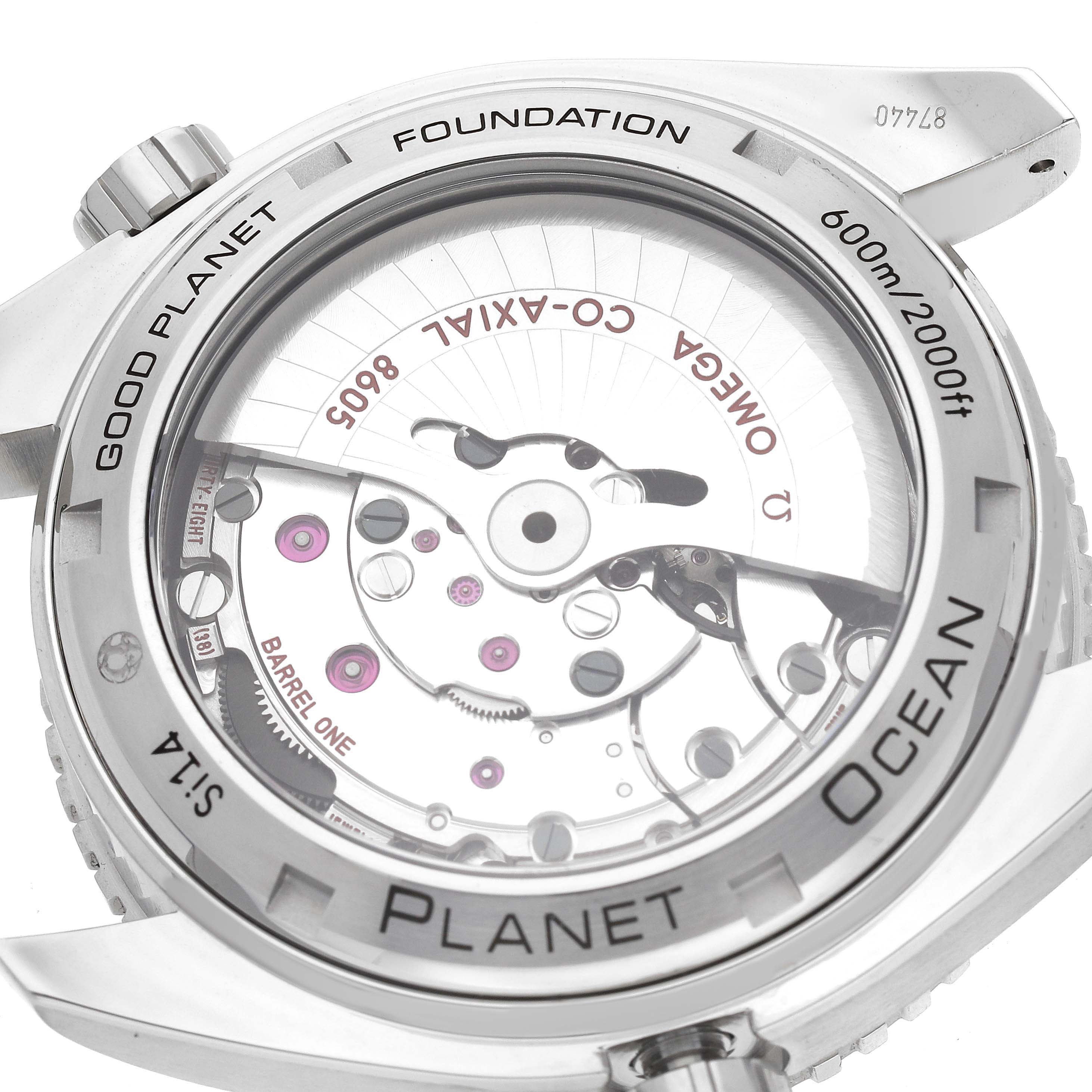 The image shows the back case of the Omega Planet Ocean 232.32.44.22.03.001 Men
s Stainless Steel Blue Dial 232.32.44.22.03.001 Men
s Stainless Steel Blue Dial watch, revealing the internal mechanism and engravings.