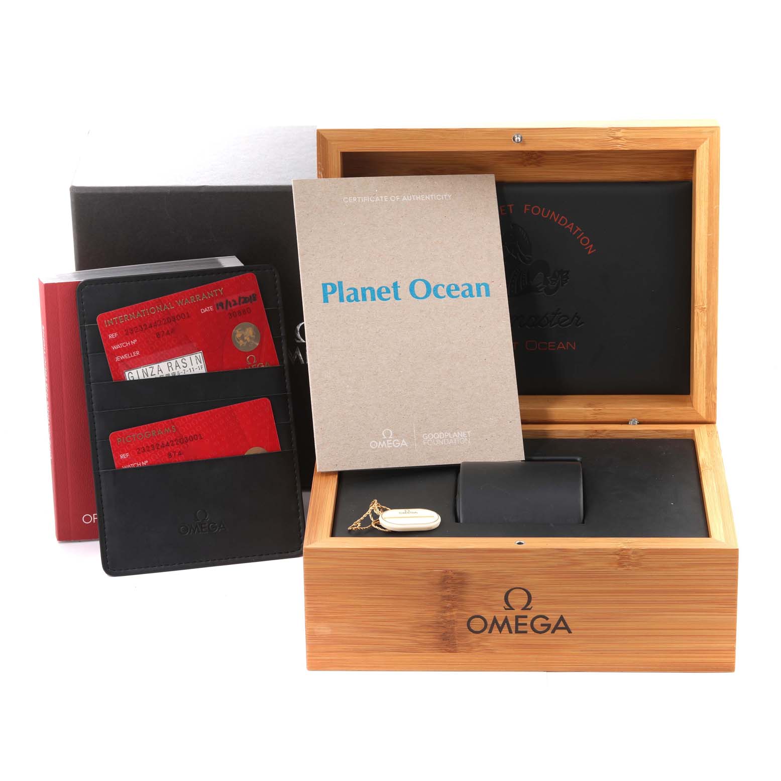 The image shows an Omega Planet Ocean 232.32.44.22.03.001 Men
s Stainless Steel Blue Dial 232.32.44.22.03.001 Men
s Stainless Steel Blue Dial watch box, instruction manuals, warranty cards, and an Best Quality
ity certificate.