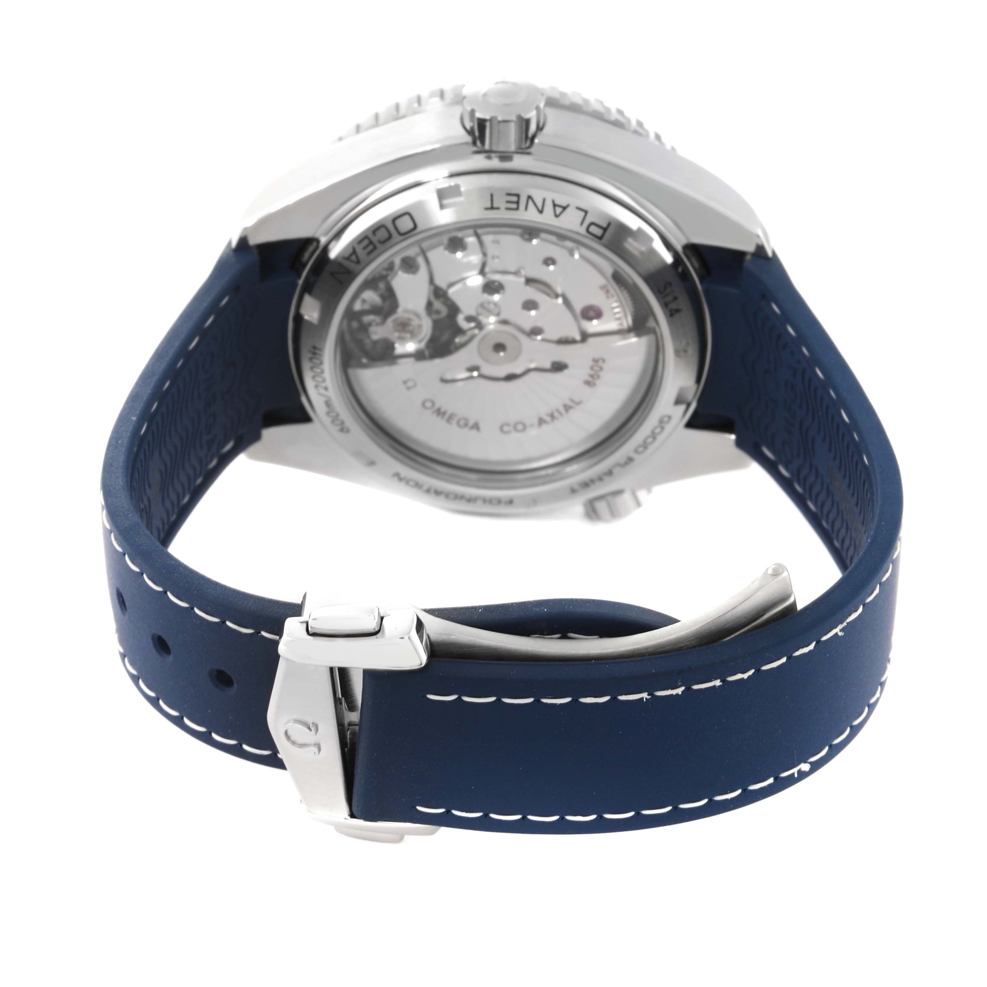 The image shows the back view of an Omega Planet Ocean 232.32.44.22.03.001 Men
s Stainless Steel Blue Dial 232.32.44.22.03.001 Men
s Stainless Steel Blue Dial watch, highlighting the movement and blue strap.