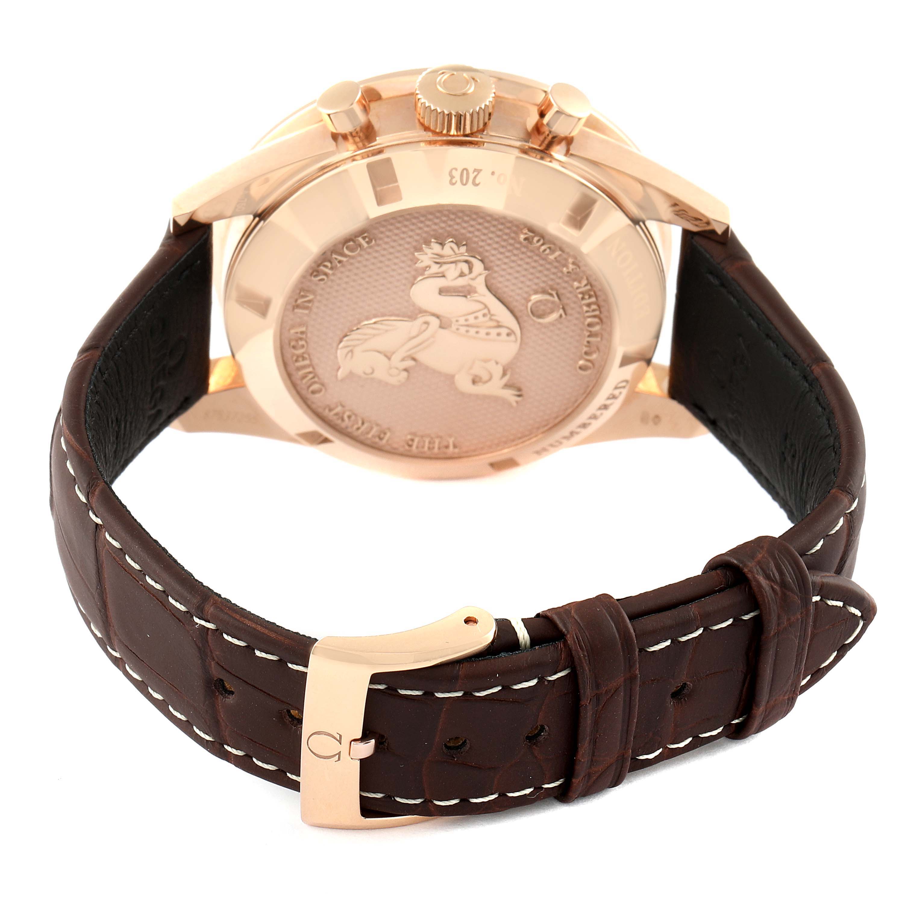 The image shows the back case and clasp of an Omega Speedmaster 311.63.40.30.02.001 Men's Rose Gold Silver Dial 311.63.40.30.02.001 Men's Rose Gold Silver Dial watch, highlighting the engraving and leather strap.