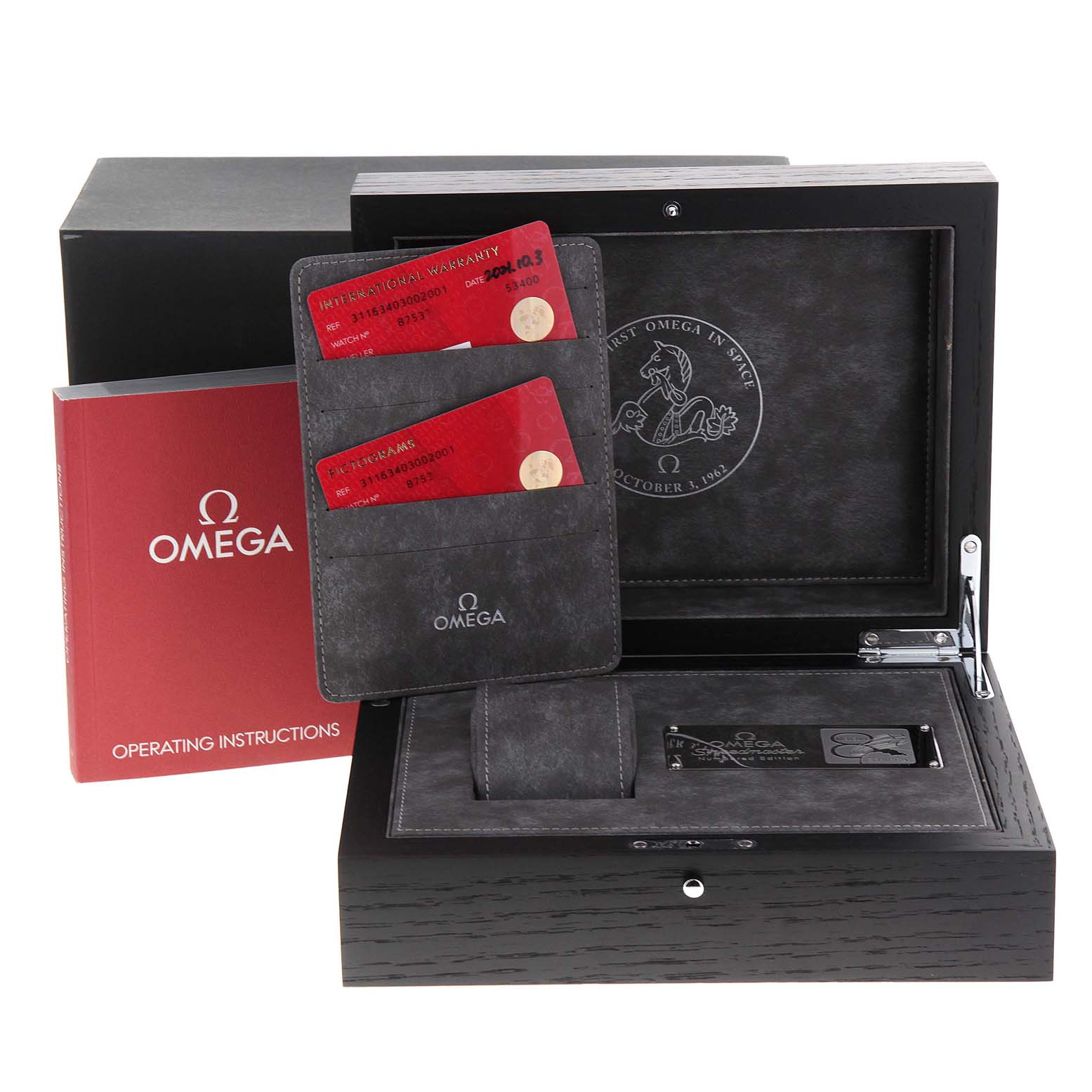 The image shows the packaging for the Omega Speedmaster 311.63.40.30.02.001 Men's Rose Gold Silver Dial 311.63.40.30.02.001 Men's Rose Gold Silver Dial, including a box, cards, and operating instructions, viewed from an angle above and slightly to the side.