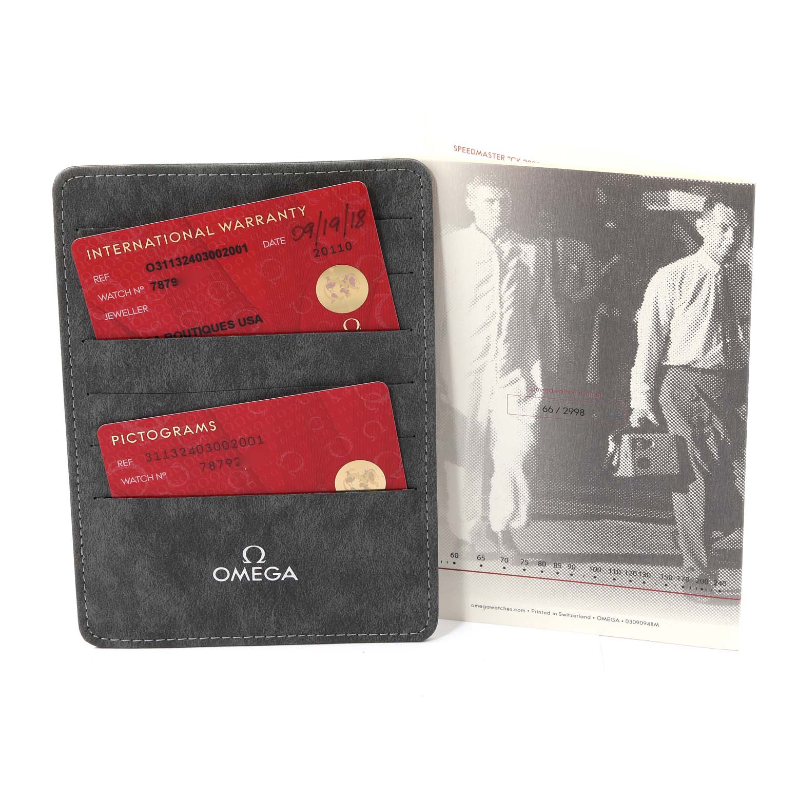 The image shows the warranty cards and literature for the Omega Speedmaster 311.32.40.30.02.001 Men's Stainless Steel Silver Dial 311.32.40.30.02.001 Men's Stainless Steel Silver Dial model, displayed in a grey cardholder with the Omega logo.