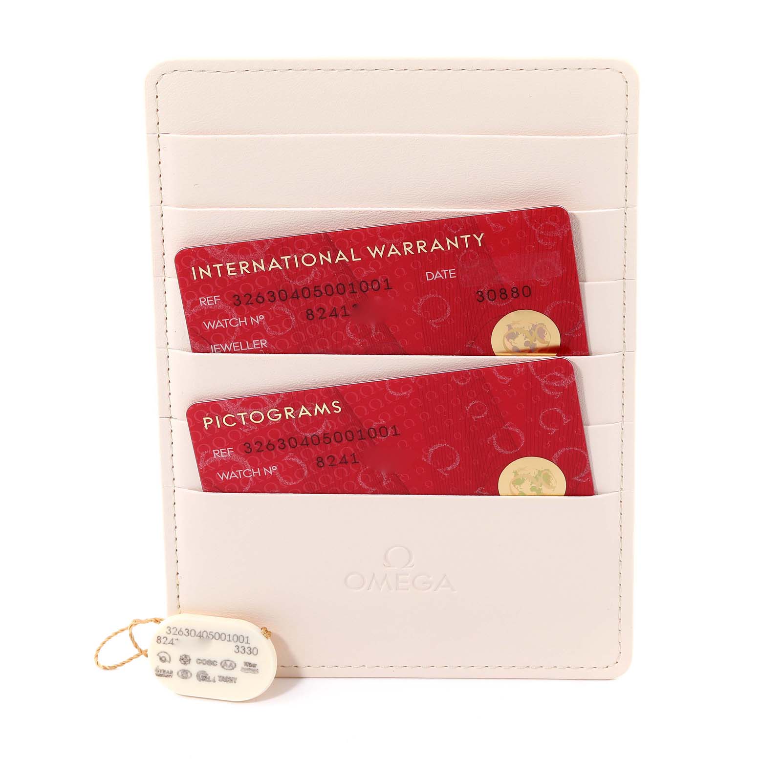 This image shows the warranty cards and tag for an Omega Speedmaster 326.30.40.50.01.001 Men
s Stainless Steel Black Dial 326.30.40.50.01.001 Men
s Stainless Steel Black Dial model along with a cream-colored card holder.