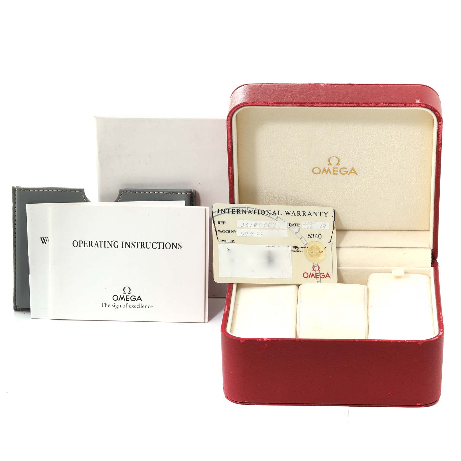 The image shows the packaging and accessories for an Omega Speedmaster 3518.50.00 Men's Stainless Steel Black Dial 3518.50.00 Men's Stainless Steel Black Dial, including an open box, warranty card, and operating instructions.