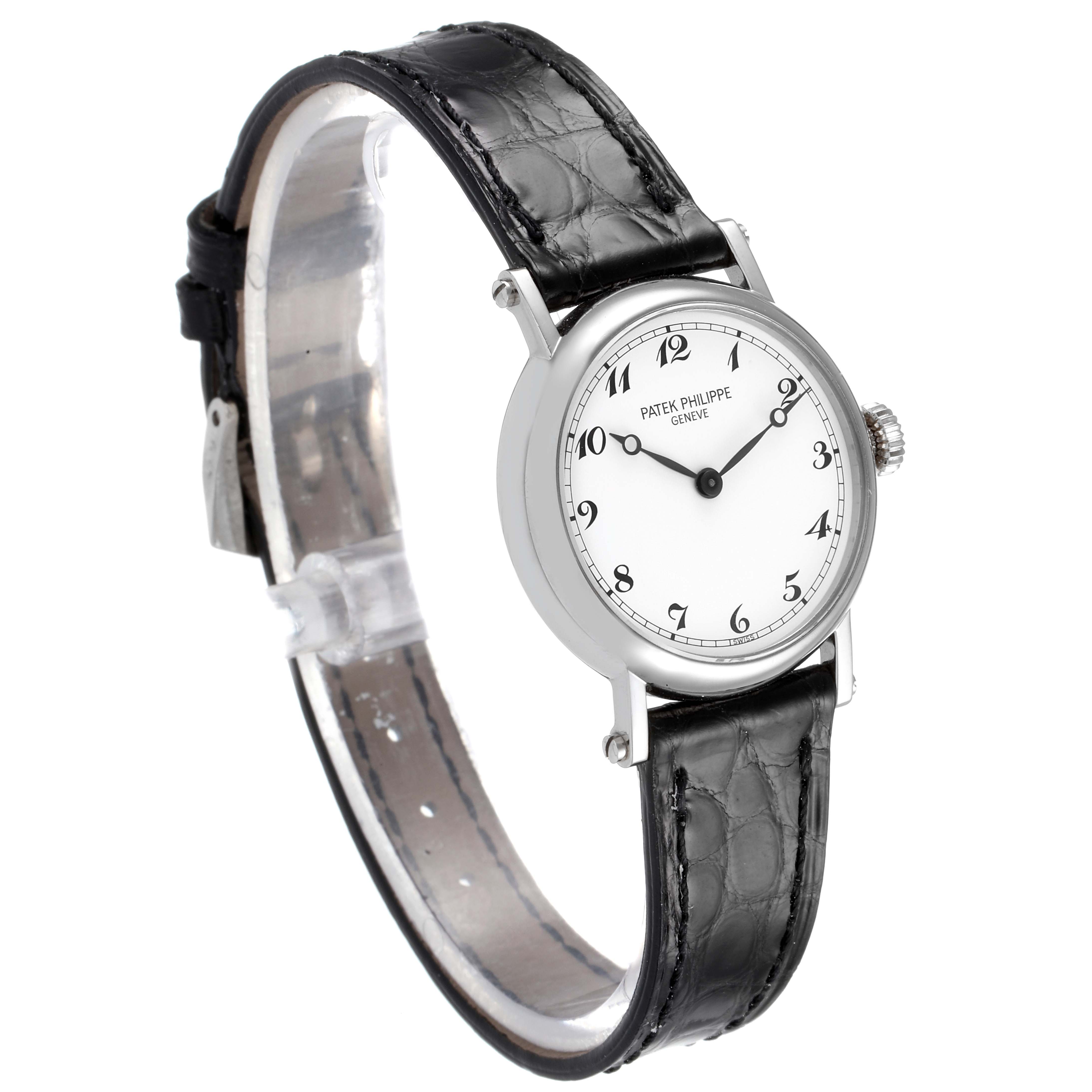 The image shows a side angle view of the Patek Philippe Calatrava 4860G Women's White Gold White Dial 4860G Women's White Gold White Dial watch, highlighting the dial, crown, and leather strap.
