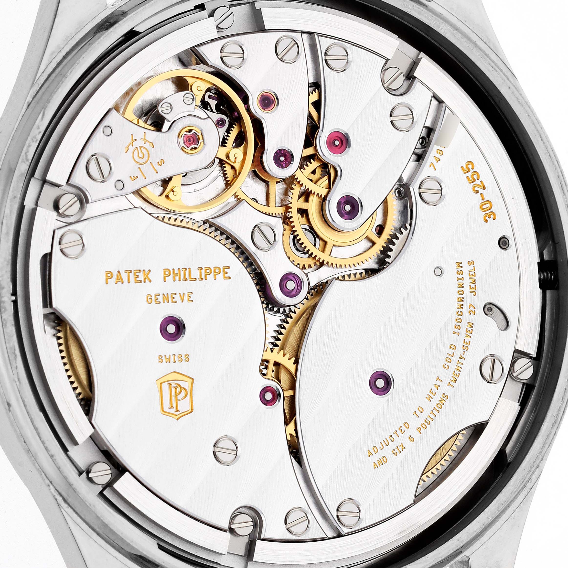 The image shows the rear view of the Calatrava watch by Patek Philippe, highlighting its intricate movement and internal mechanisms.