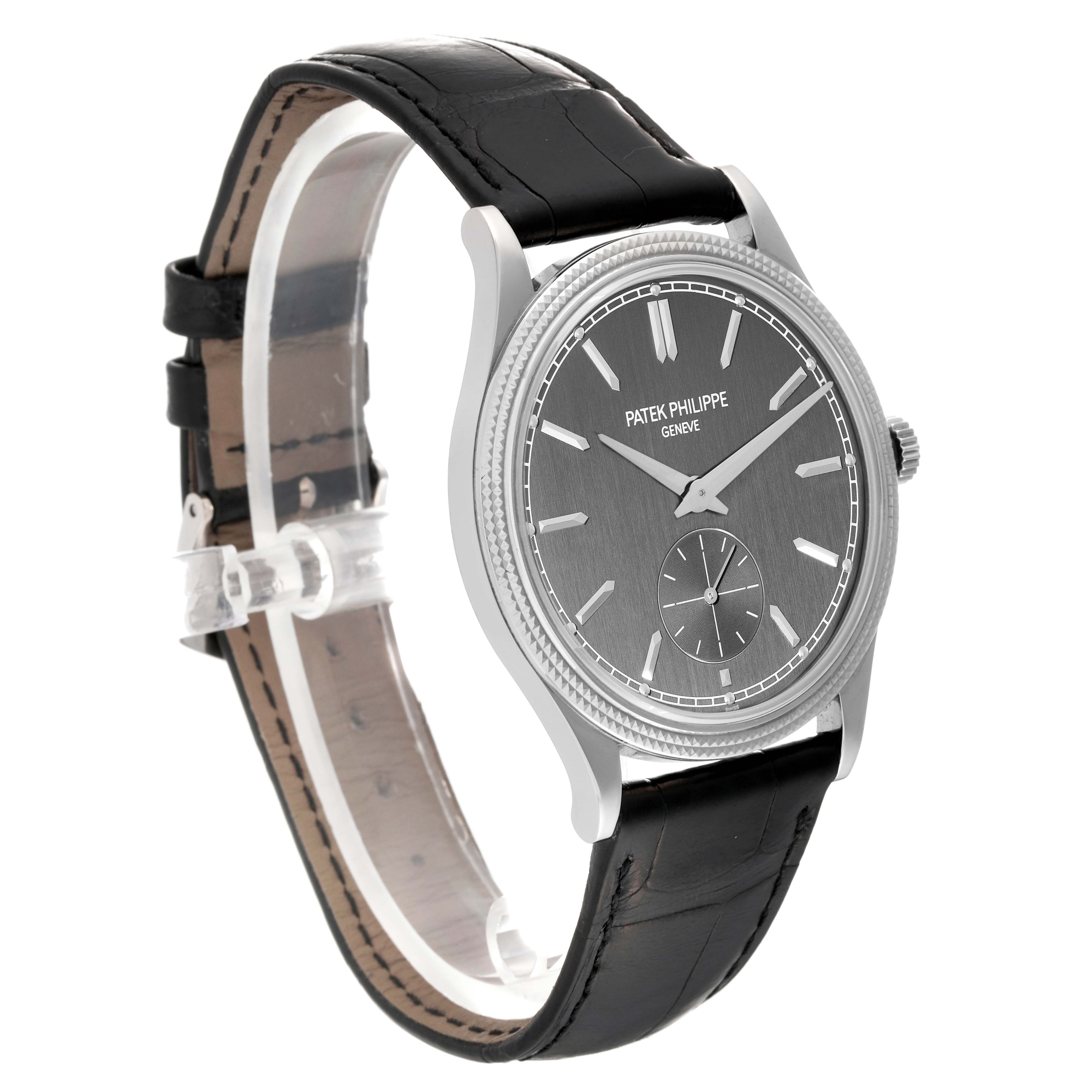 The Patek Philippe Calatrava 6119 Men's White Gold Grey Dial 6119 Men's White Gold Grey Dial watch is shown from a three-quarter angle, highlighting the face, dial, and leather strap.