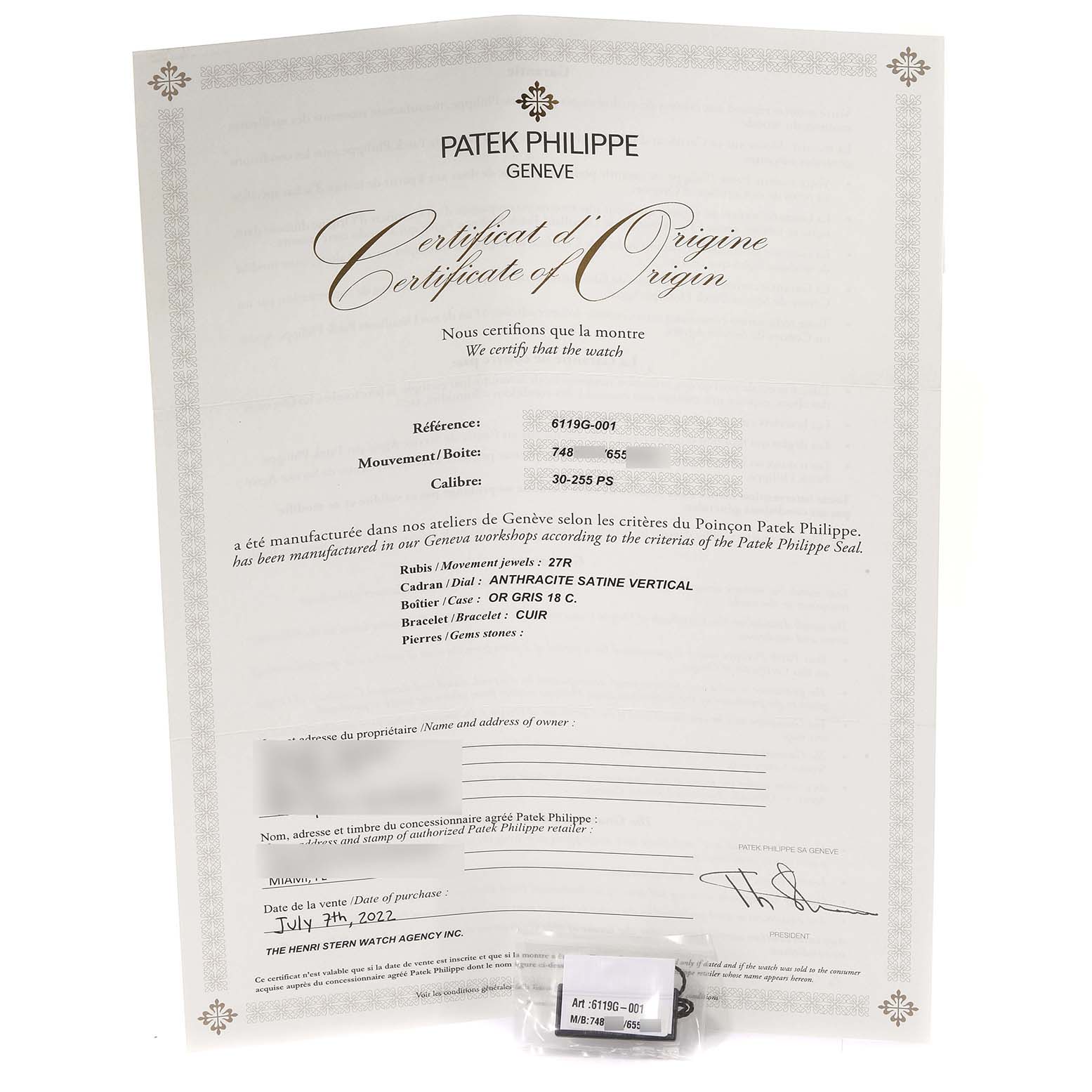 The image shows the certificate of origin for a Patek Philippe Calatrava 6119 Men's White Gold Grey Dial 6119 Men's White Gold Grey Dial watch and a small labeled packet.