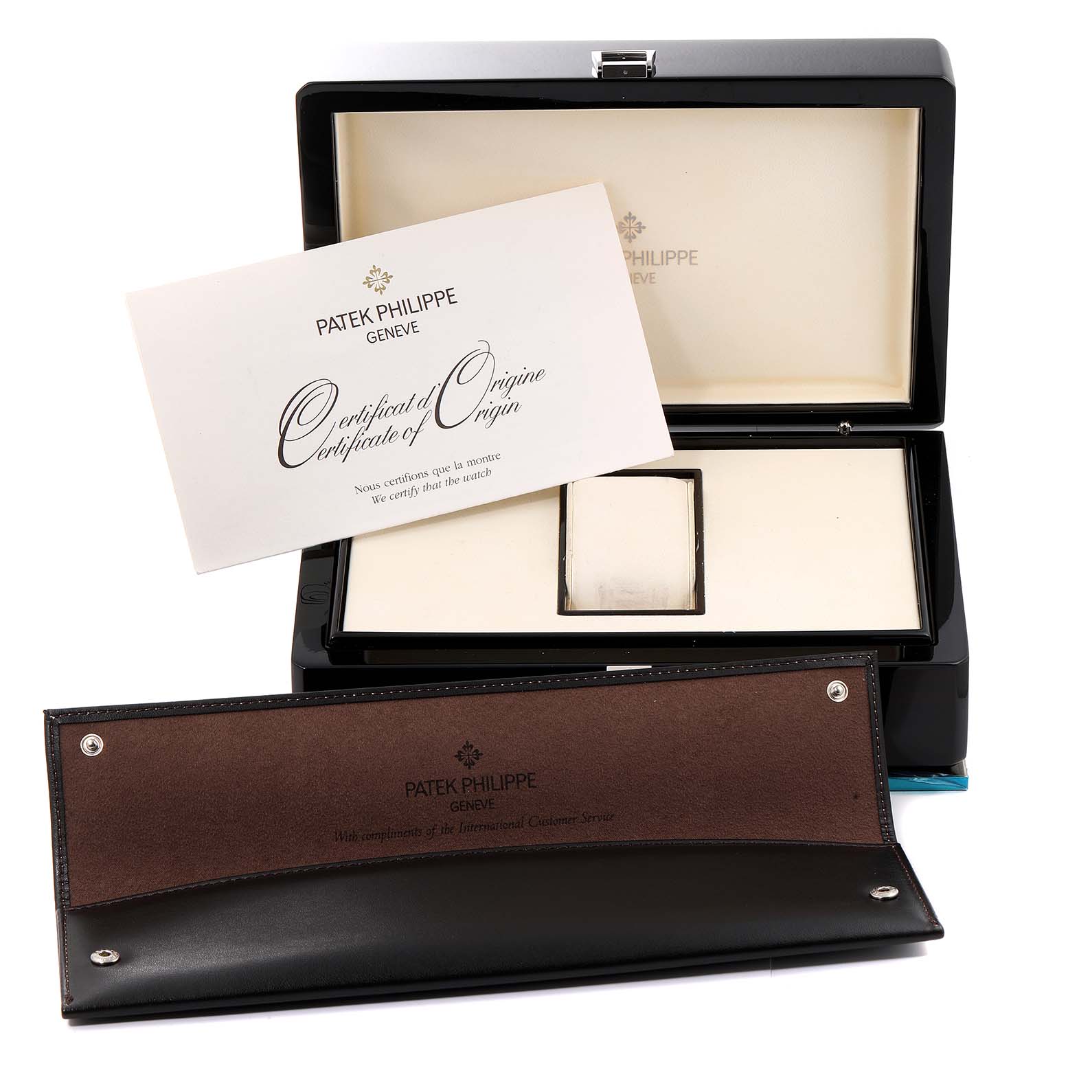 The image shows a Patek Philippe Calatrava 5140G-001 Men's White Gold Silver Dial 5140G-001 Men's White Gold Silver Dial watch box and certificate, along with a brown leather case.