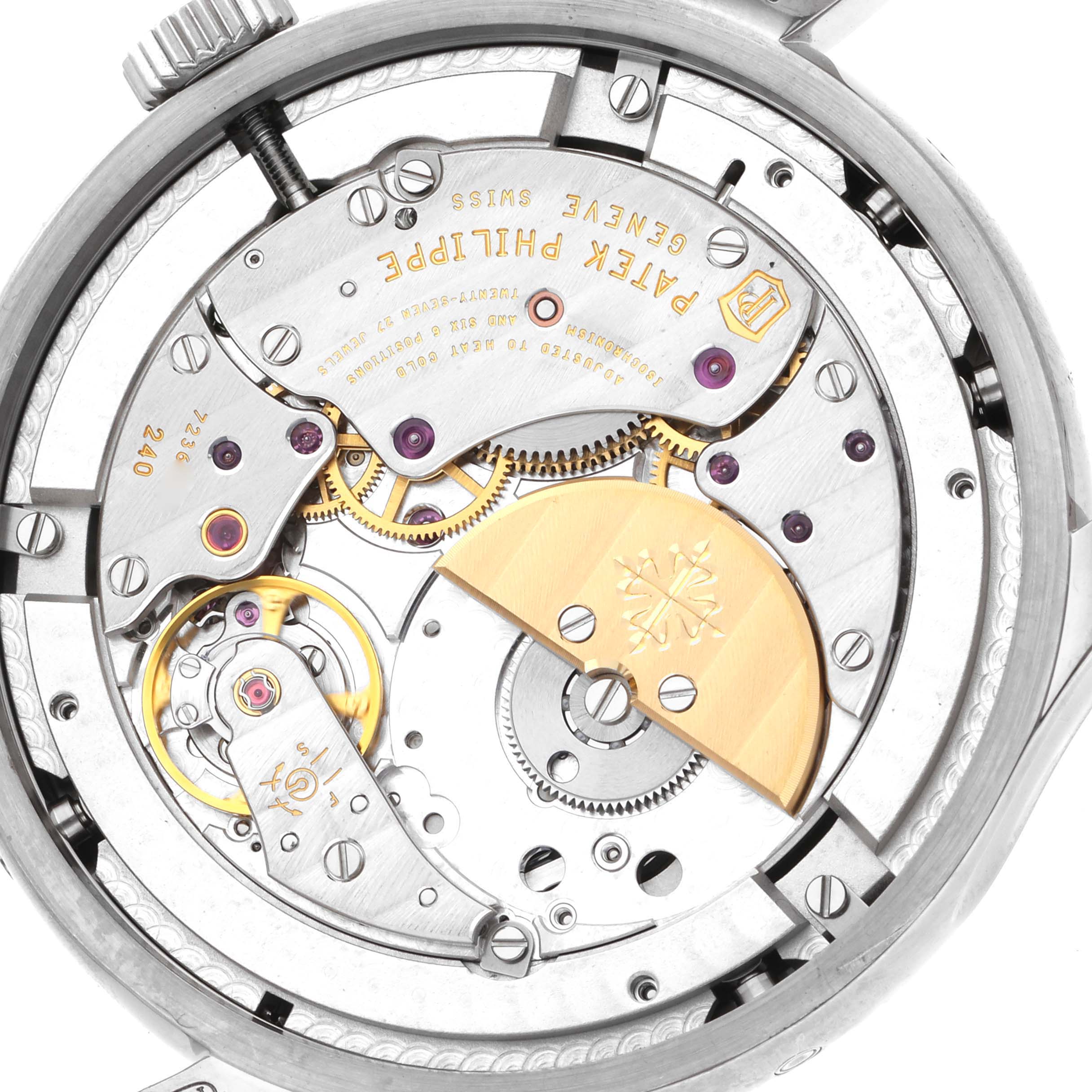 The image shows the back of a Patek Philippe Complications 5327G-001 Men
s White Gold Blue Dial 5327G-001 Men
s White Gold Blue Dial model, highlighting its intricate mechanical movement.