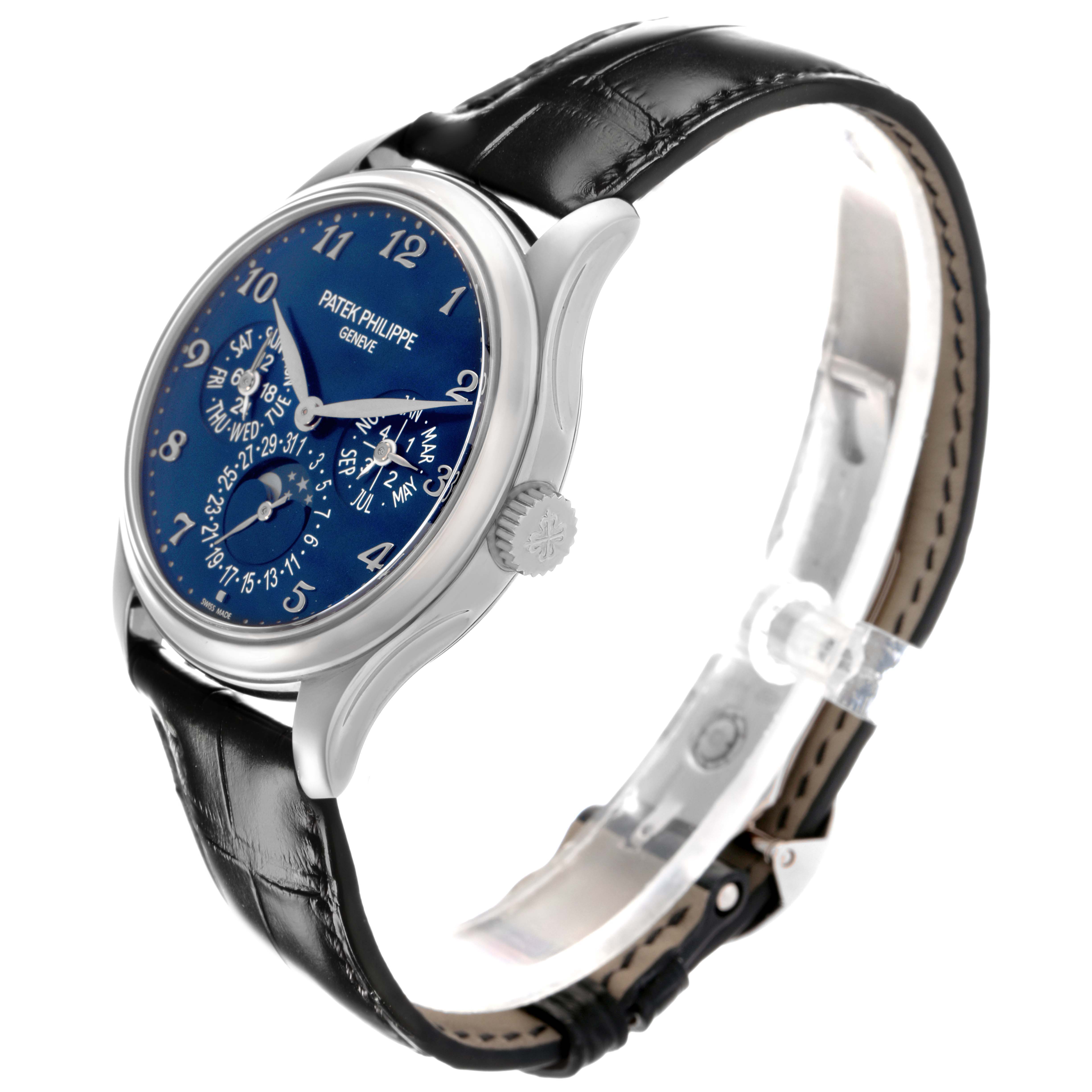 The Patek Philippe Complications 5327G-001 Men
s White Gold Blue Dial 5327G-001 Men
s White Gold Blue Dial watch is shown at a three-quarter angle, highlighting the face, crown, and leather strap.