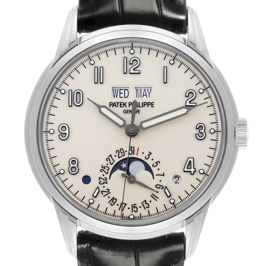 The Patek Philippe Complications watch is shown from the front, displaying its dial, hands, moon phase, and calendar functions.
