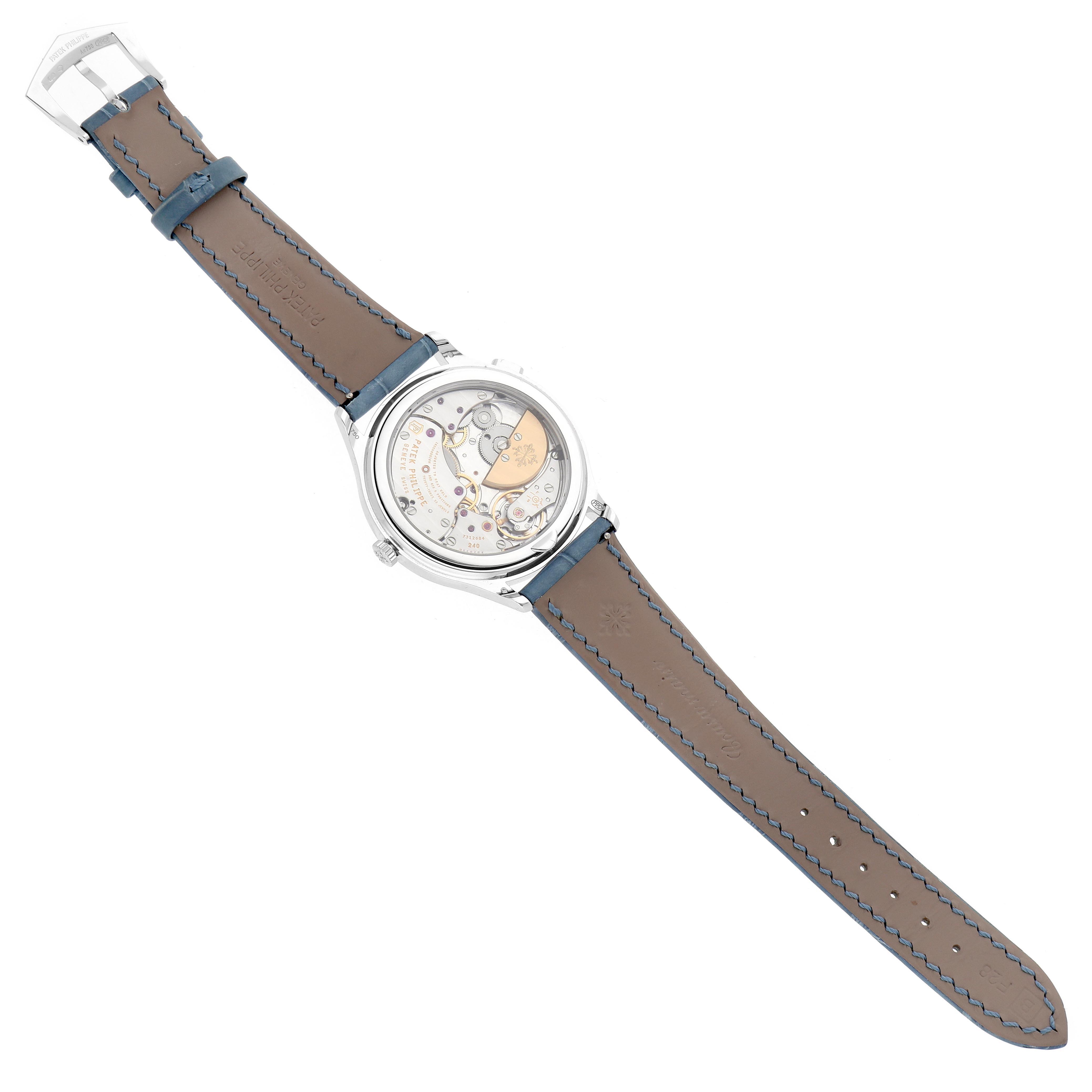 The image shows the backside of a Patek Philippe Complications 7130G-016 Men
s White Gold Blue Dial 7130G-016 Men
s White Gold Blue Dial model, highlighting the movement and leather strap.