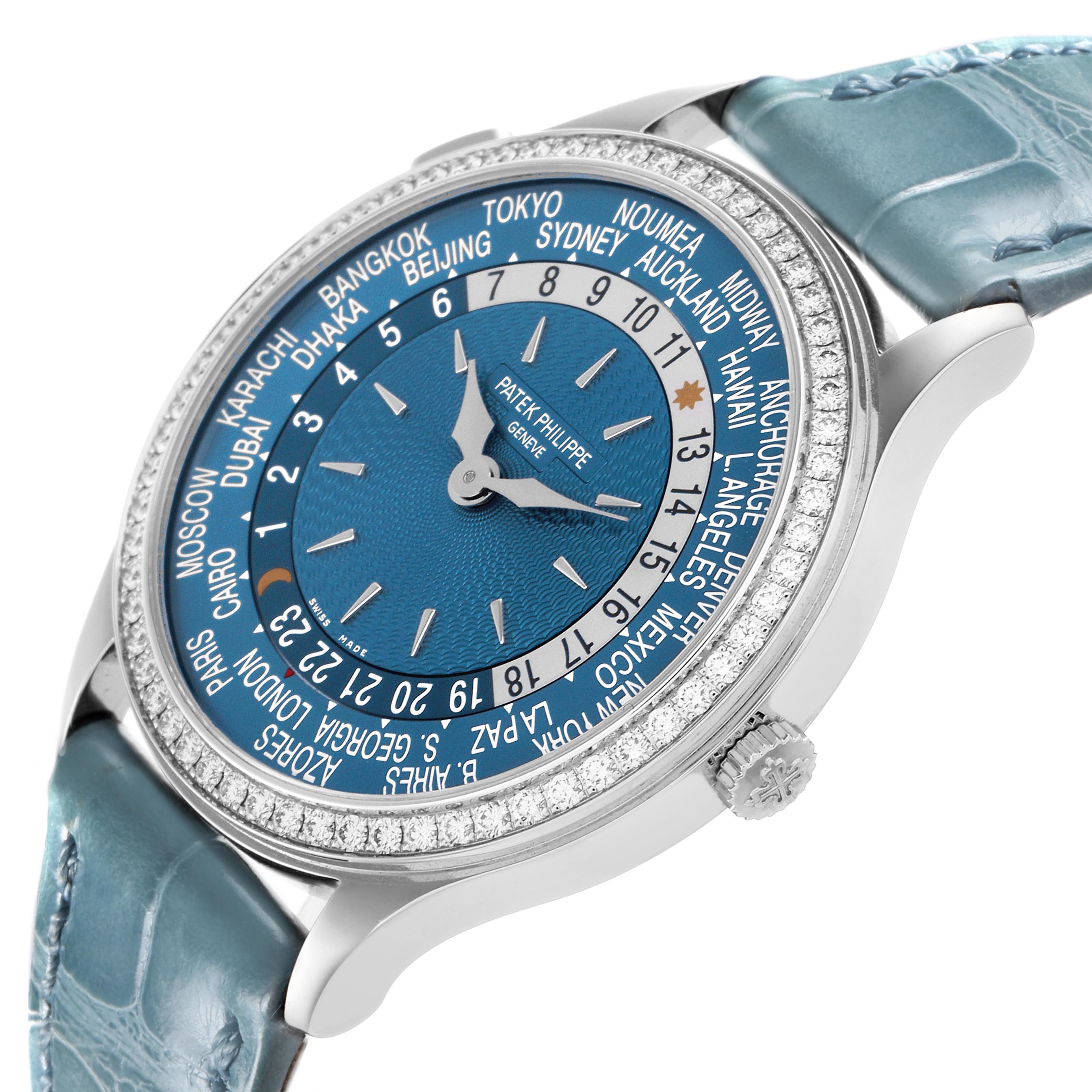 The image shows a Patek Philippe Complications 7130G-016 Men
s White Gold Blue Dial 7130G-016 Men
s White Gold Blue Dial watch at a slight angle, highlighting the dial, bezel, crown, and blue leather strap.