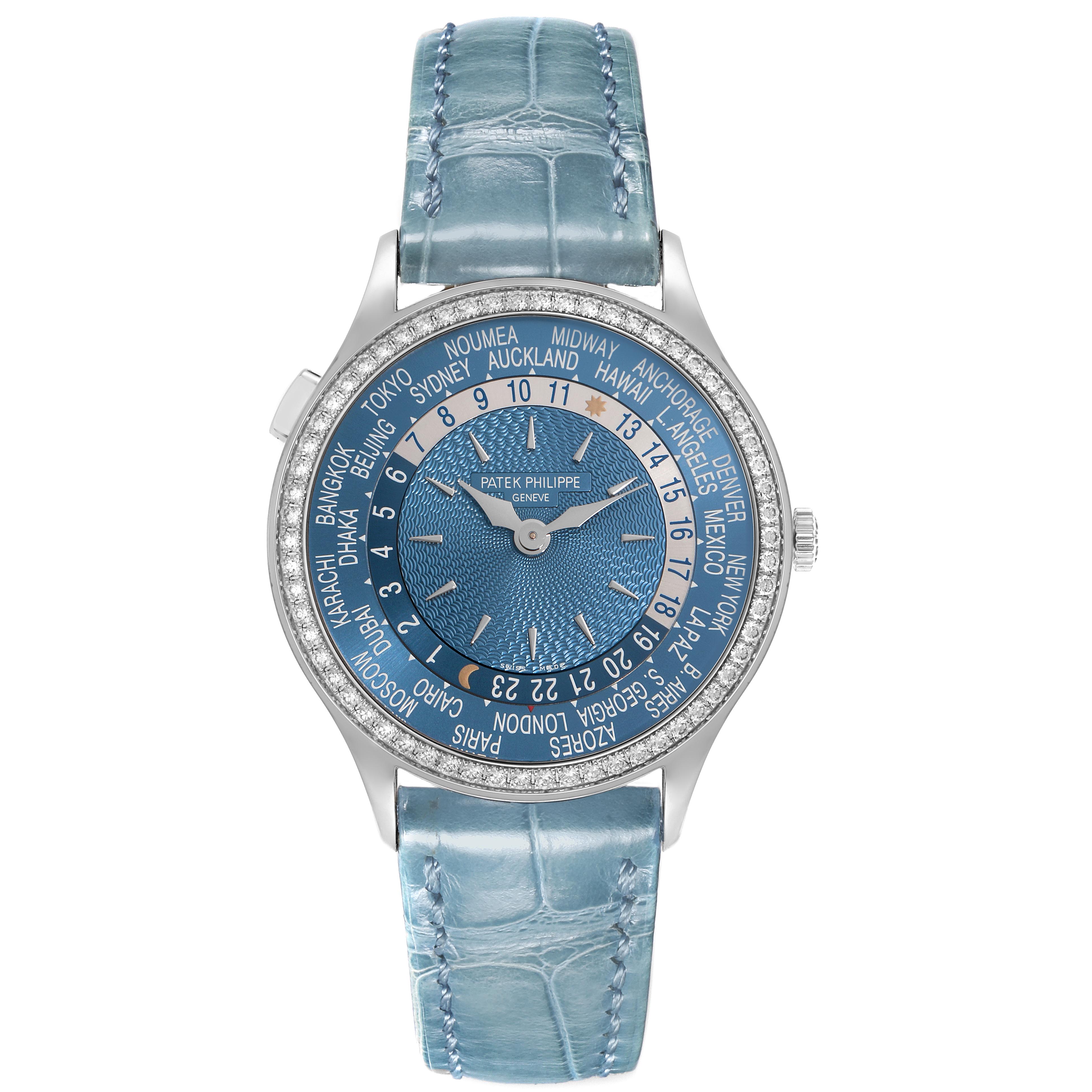 The Patek Philippe Complications 7130G-016 Men
s White Gold Blue Dial 7130G-016 Men
s White Gold Blue Dial watch is shown from a top-down angle, displaying the full face and blue leather strap.