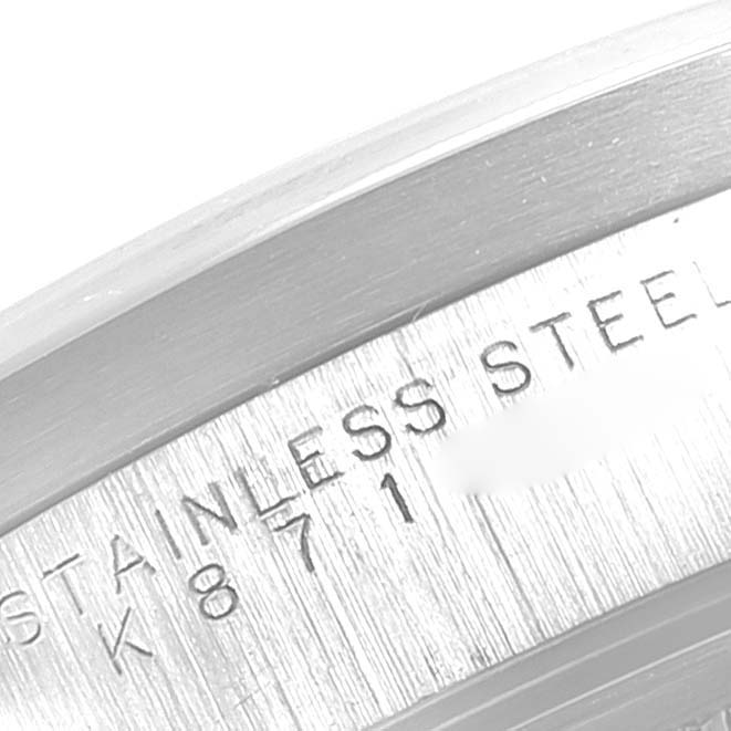 The image shows a close-up of the engraved bezel of a Rolex Air-King 14010 Men's Stainless Steel Black Dial 14010 Men's Stainless Steel Black Dial watch, specifying "STAINLESS STEEL."