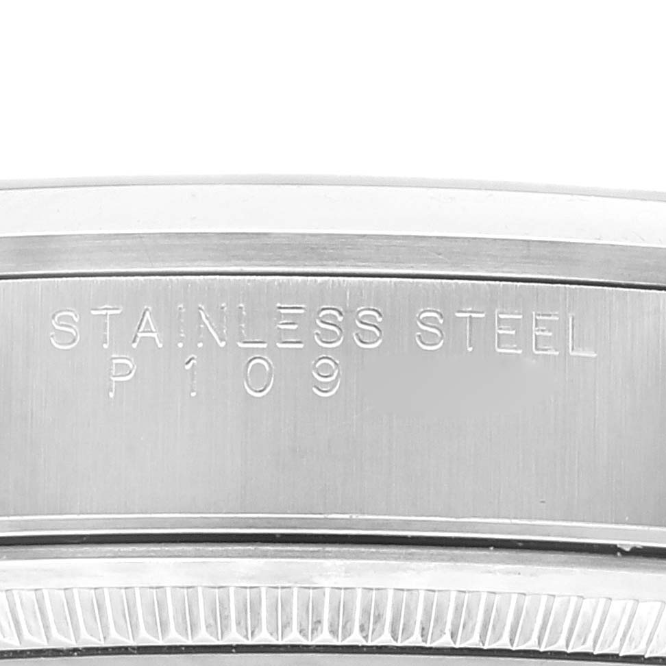 This close-up image shows the engraving on the stainless steel band of a Rolex Air-King 14000 Men's Stainless Steel Black Dial 14000 Men's Stainless Steel Black Dial watch.