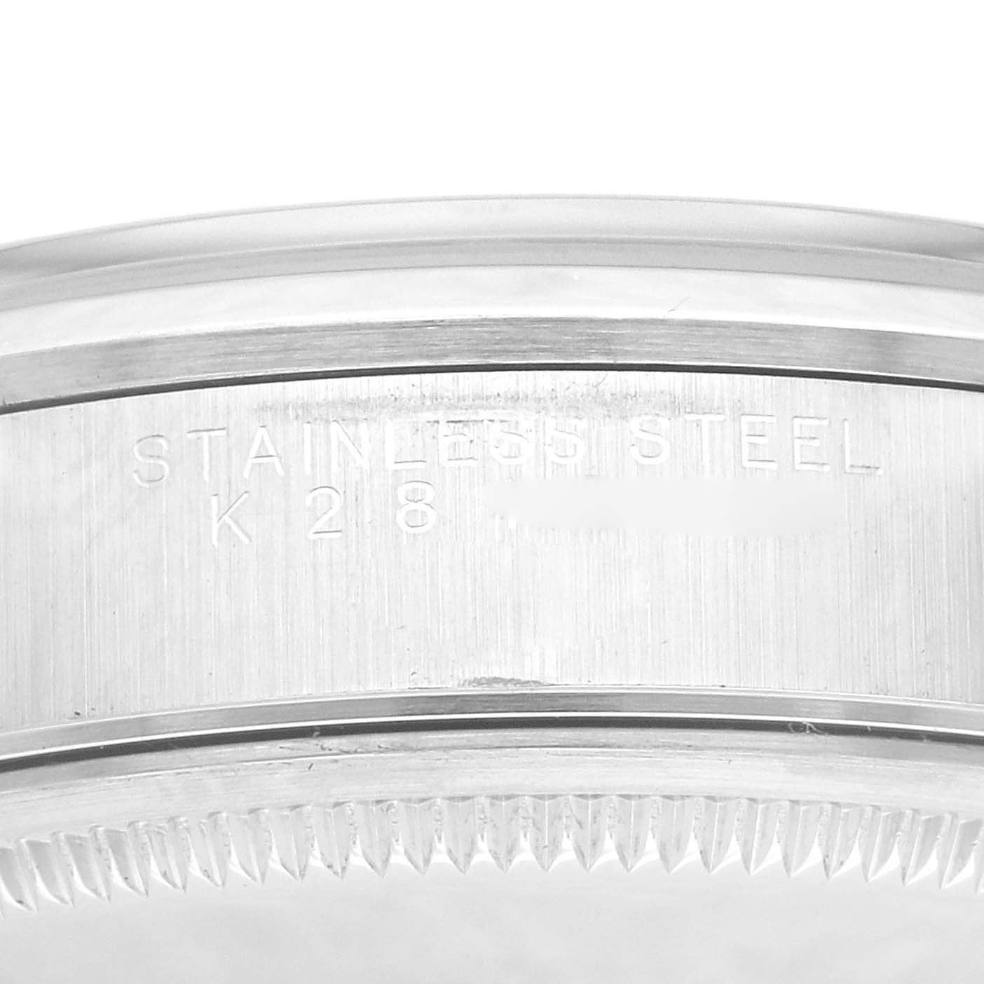 This image shows the side of a Rolex Air-King 14000M Men's Stainless Steel Blue Dial 14000M Men's Stainless Steel Blue Dial watch case, highlighting the engraved stainless steel marking.