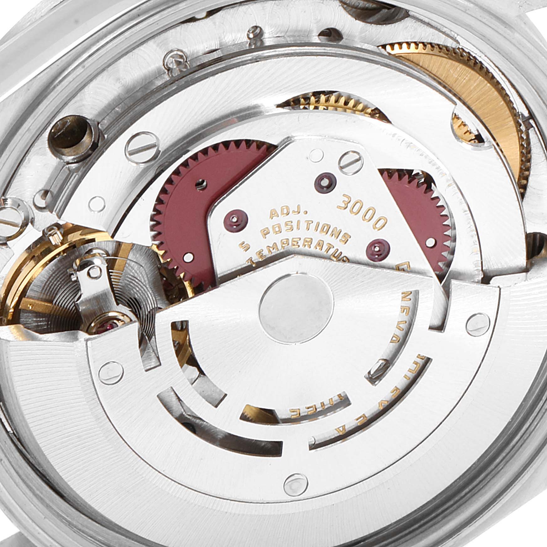 This image shows a close-up view of the movement of a Rolex Air-King 14000 Men's Stainless Steel Silver Dial 14000 Men's Stainless Steel Silver Dial watch, highlighting gears and mechanical parts.