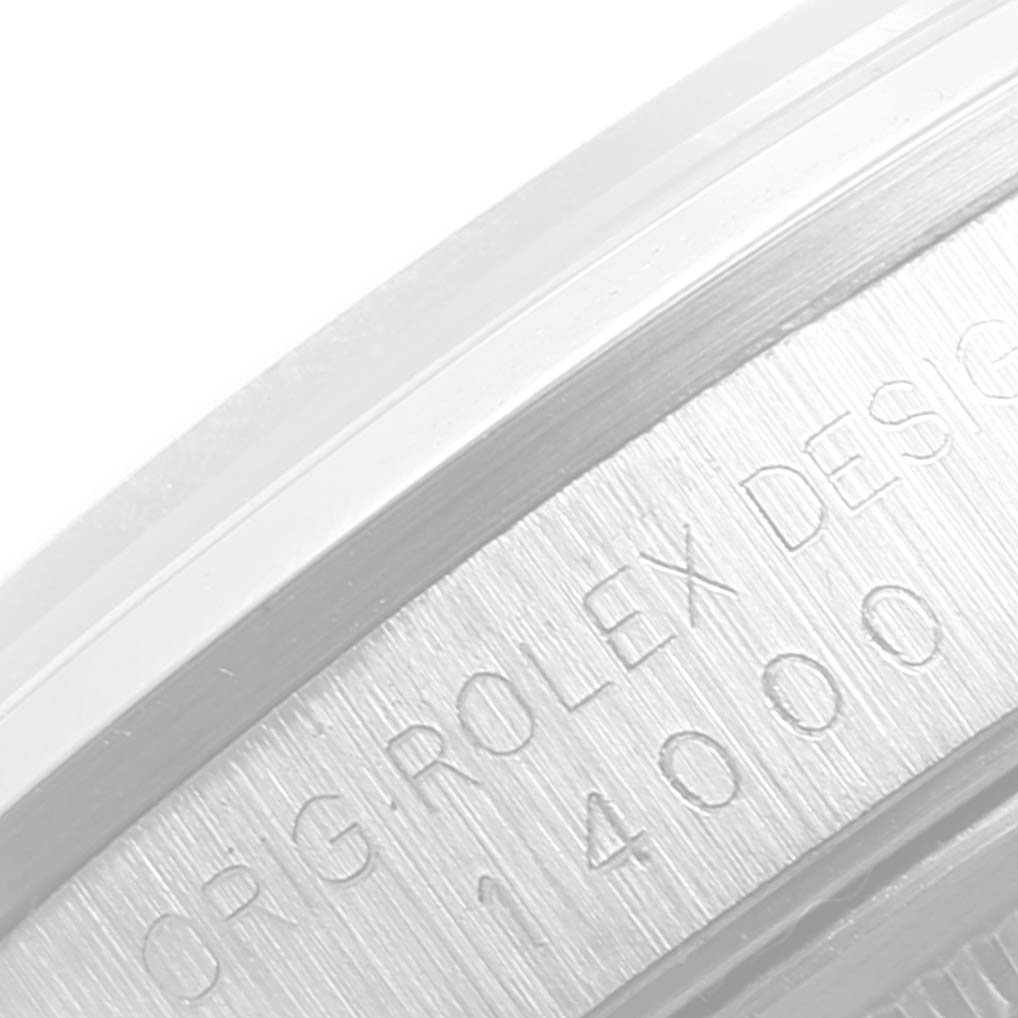 The close-up image shows the engraved bezel of a Rolex Air-King 14000 Men's Stainless Steel Silver Dial 14000 Men's Stainless Steel Silver Dial watch, displaying part of the model and brand name.