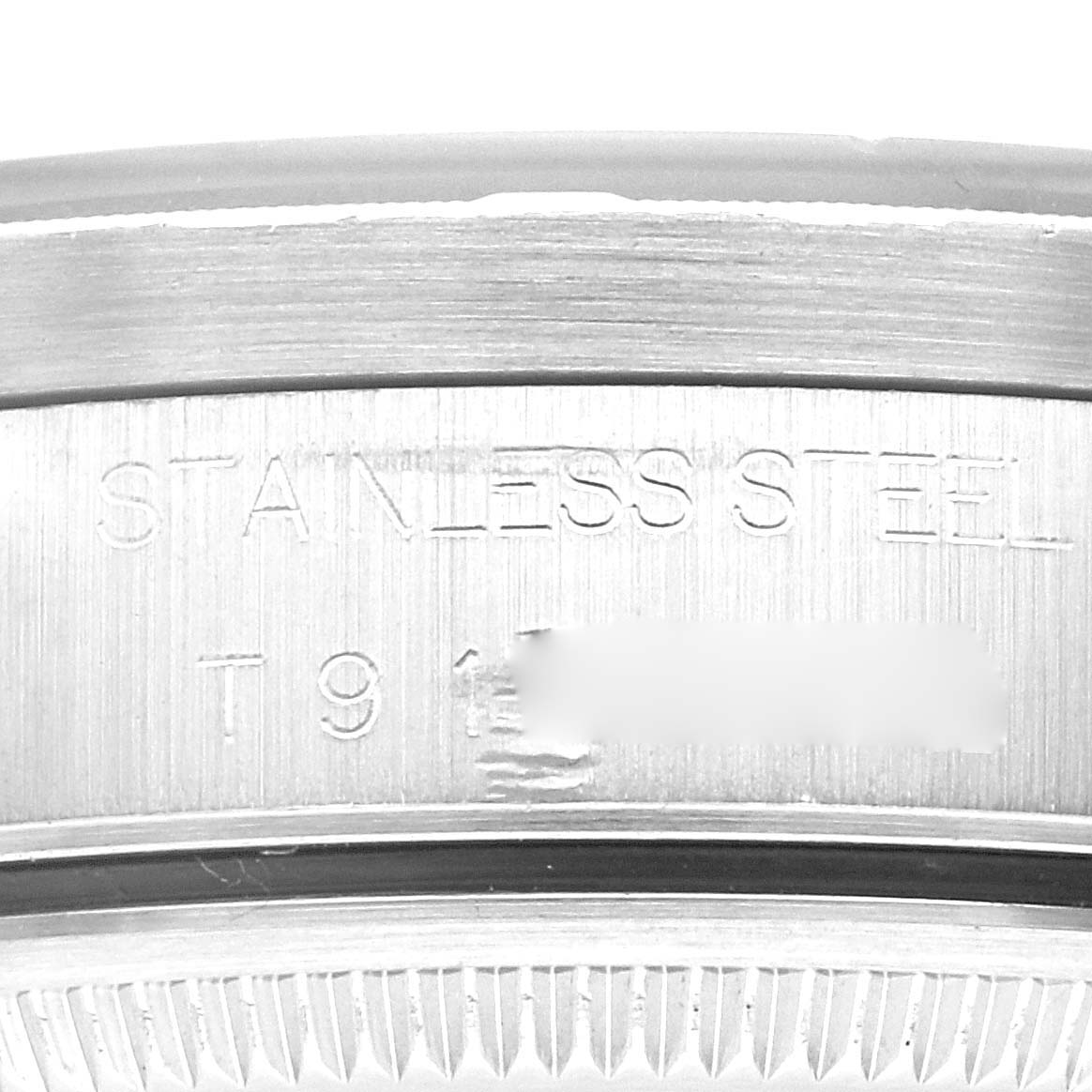 The image shows a close-up of the engraved stainless steel case back of a Rolex Air-King 14010 Men's Stainless Steel Black Dial 14010 Men's Stainless Steel Black Dial watch.