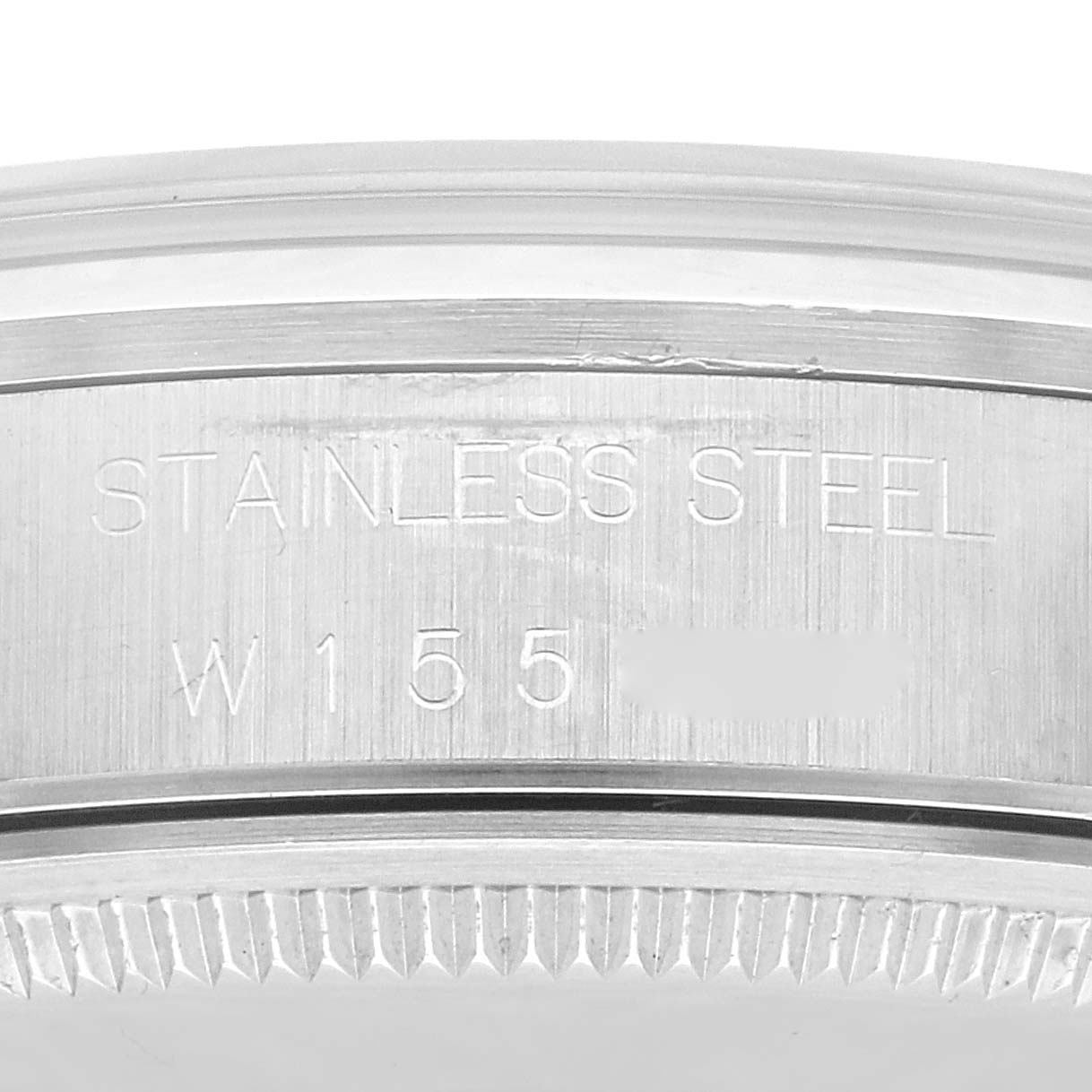 This image shows a close-up of the stainless steel case back of a Rolex Air-King 14000 Men's Stainless Steel White Dial 14000 Men's Stainless Steel White Dial watch.