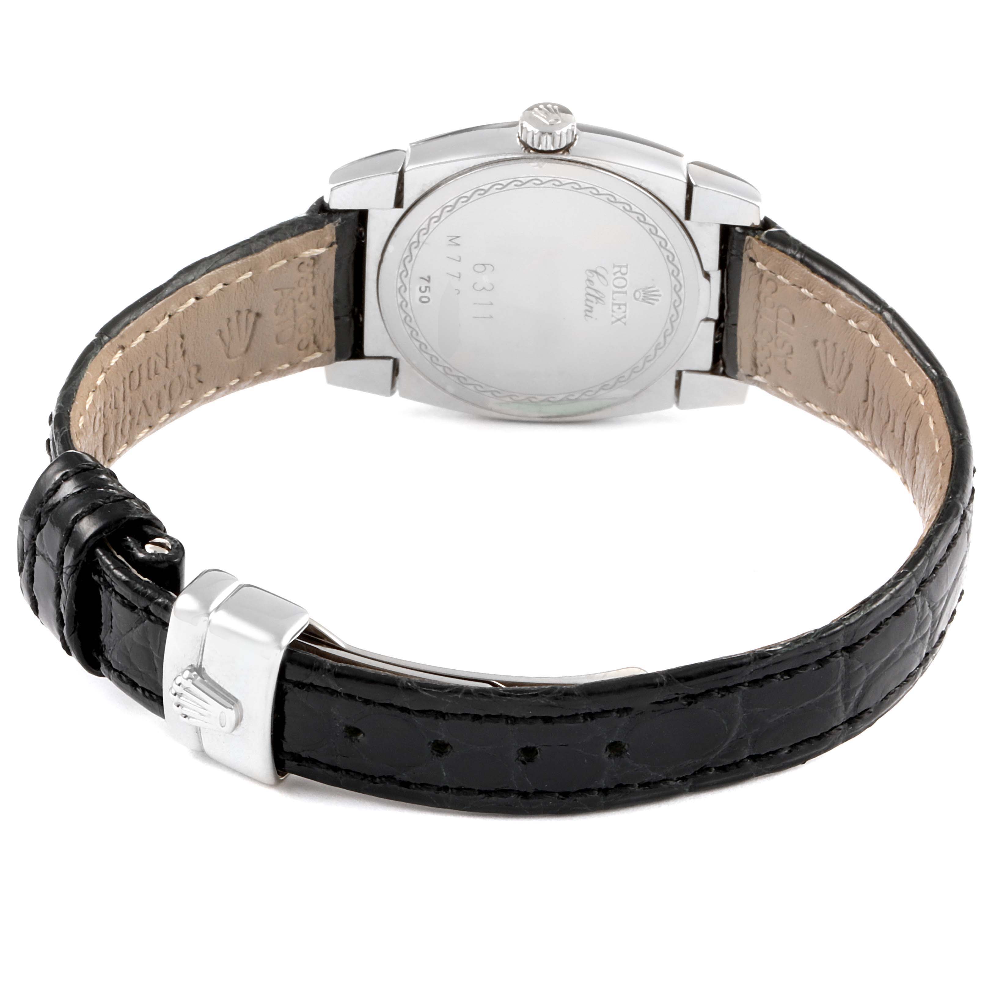 The Rolex Cellini 6311/9 Women's White Gold Mother of Pearl Dial 6311/9 Women's White Gold Mother of Pearl Dial watch is shown from the back, highlighting the case, lugs, and black leather strap with its clasp.