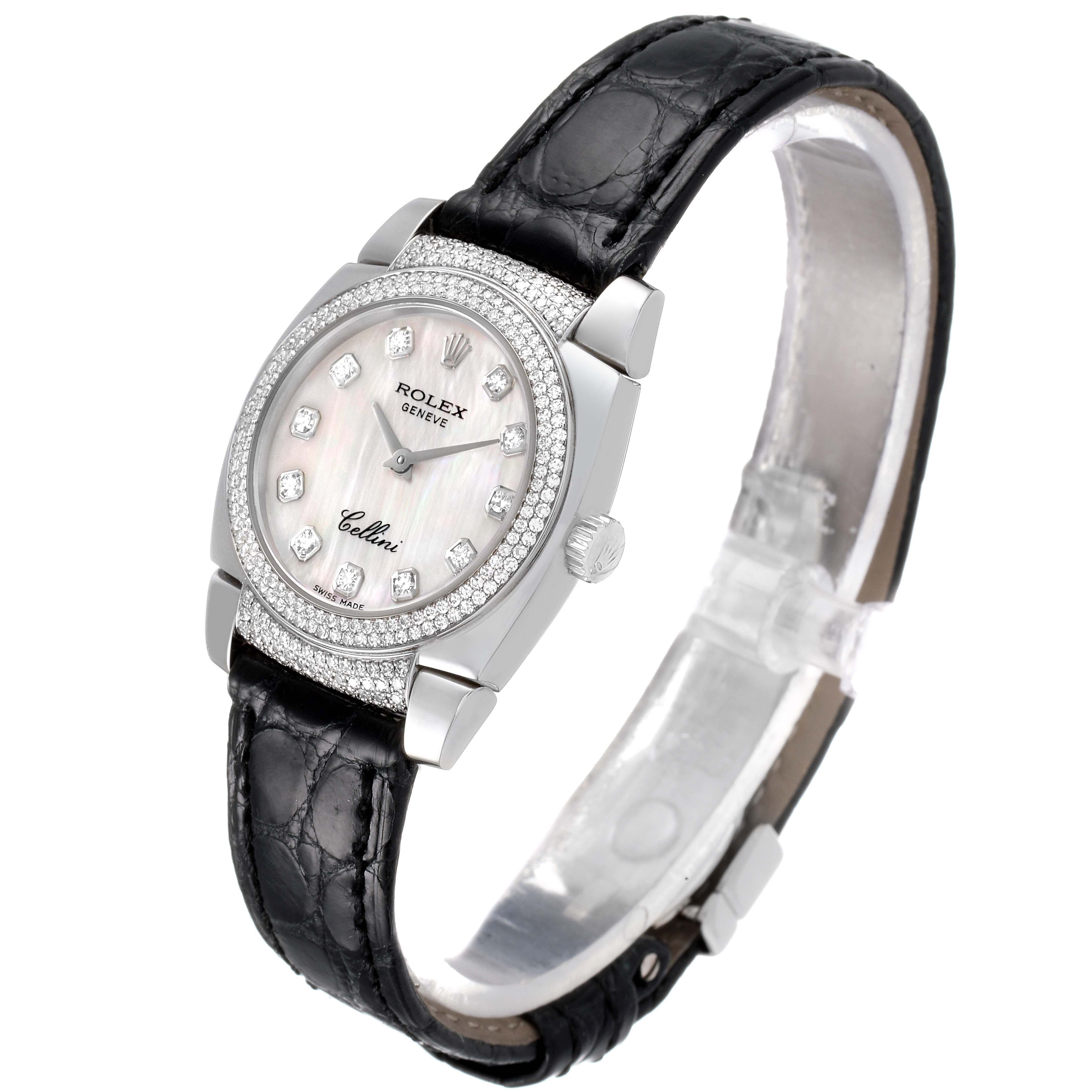 The Rolex Cellini 6311/9 Women's White Gold Mother of Pearl Dial 6311/9 Women's White Gold Mother of Pearl Dial watch is shown at a slight side angle, featuring its black strap, diamond bezel, and mother-of-pearl dial.