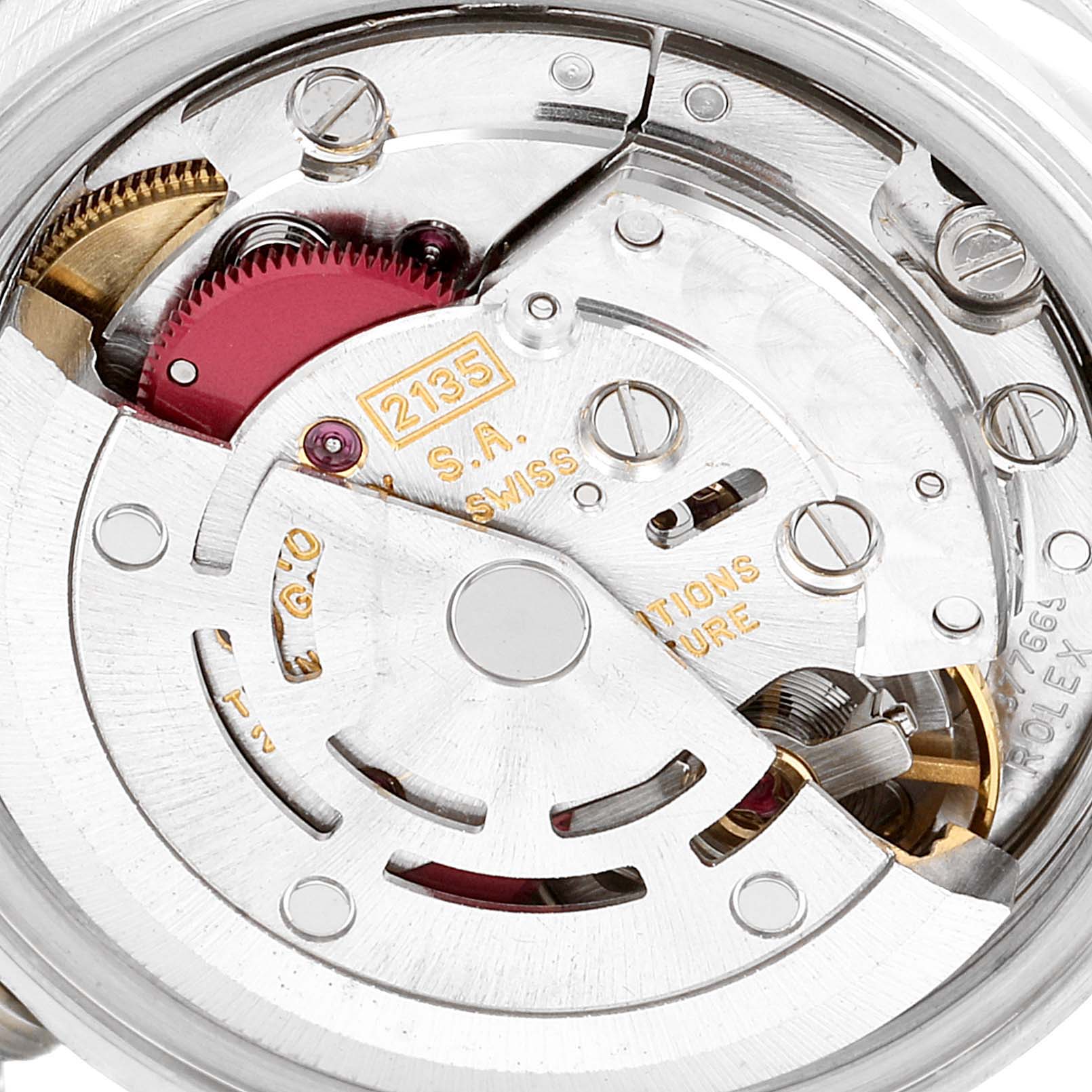 This close-up image shows the intricate inner mechanism of the Rolex Date 69190 Women's Stainless Steel Black Dial 69190 Women's Stainless Steel Black Dial model watch movement.