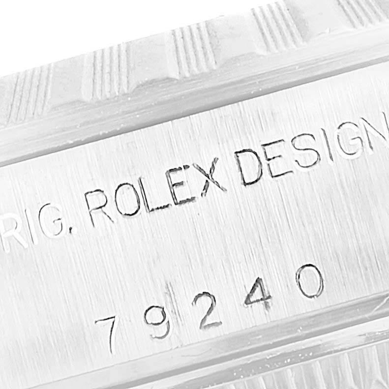 This is a close-up angle of a Rolex Datejust 79240 Women's Stainless Steel Silver Dial 79240 Women's Stainless Steel Silver Dial watch focusing on the serial number and "ROLEX DESIGN" engraving.