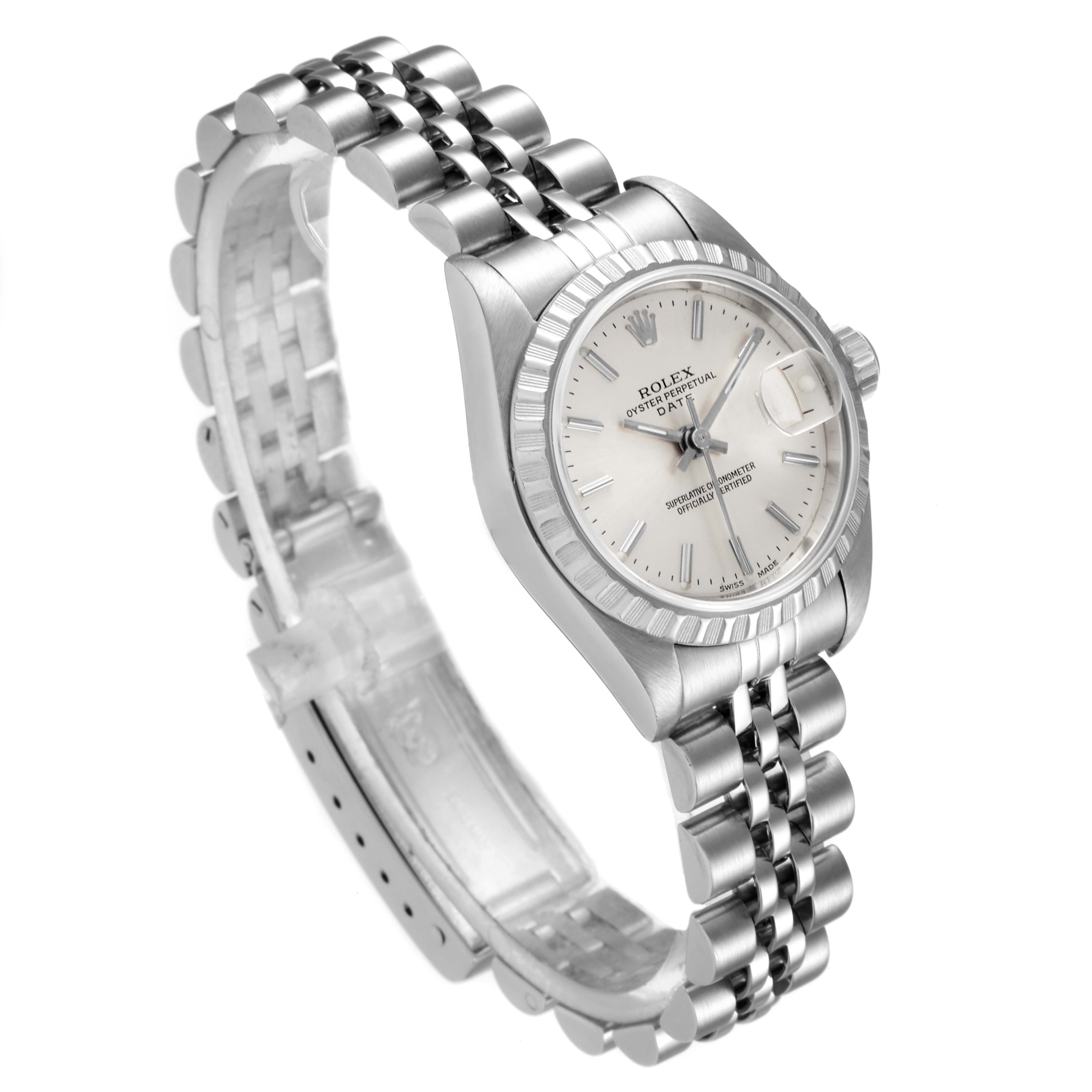 The Rolex Datejust 79240 Women's Stainless Steel Silver Dial 79240 Women's Stainless Steel Silver Dial watch is shown at an angled side view, displaying its face, fluted bezel, and Jubilee bracelet.