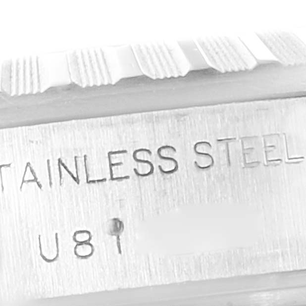 The image shows the side view of a stainless steel Rolex Date 69240 Women's Stainless Steel White Dial 69240 Women's Stainless Steel White Dial model, highlighting part of the bezel and case with engraved text.