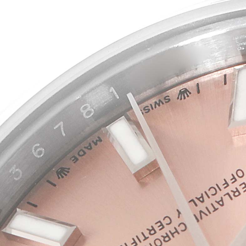 This image shows a close-up of the face and bezel of a Rolex Datejust 279160 Women's Stainless Steel Pink Dial 279160 Women's Stainless Steel Pink Dial watch, focusing on the hour markers and minute hand.
