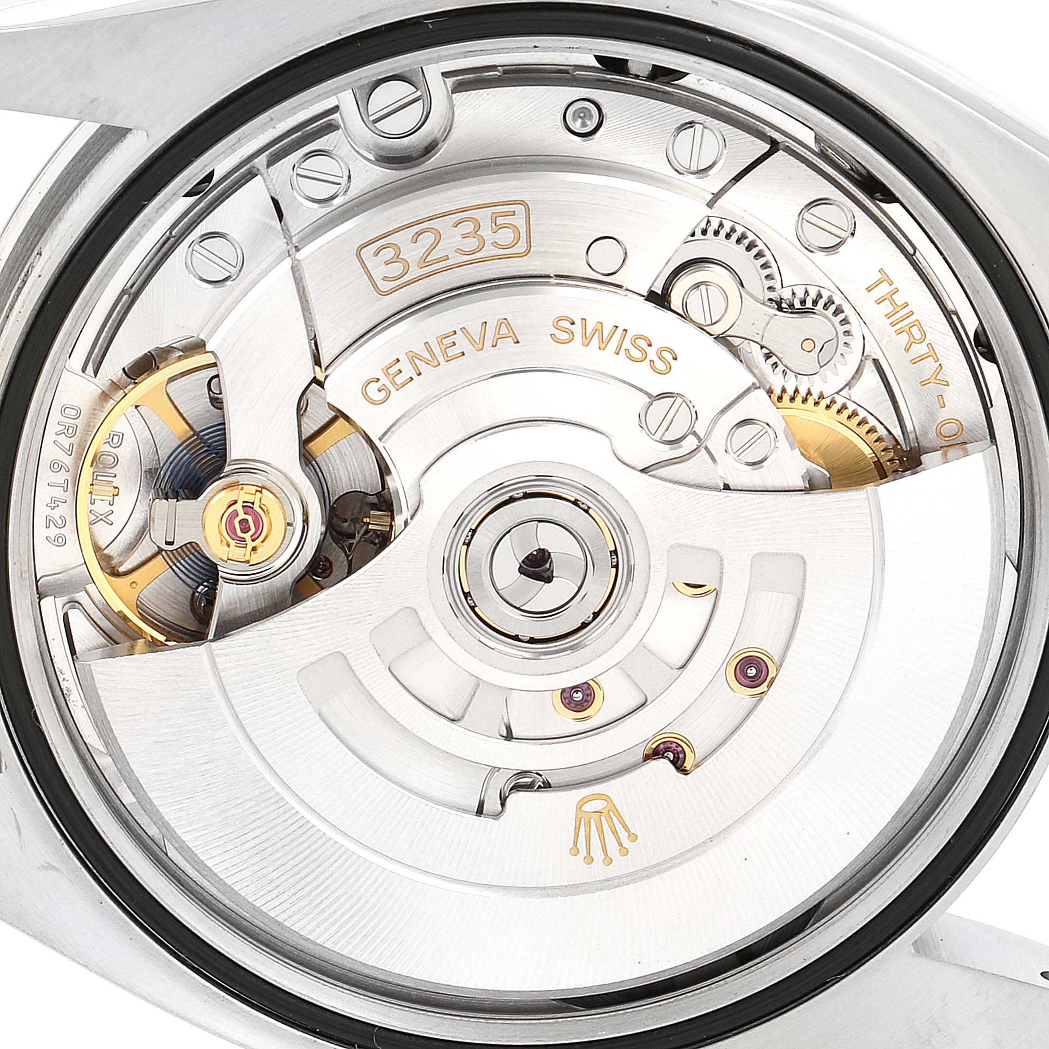 This image shows a close-up of the movement mechanism of a Rolex Datejust 126200 Men's Stainless Steel Silver Dial 126200 Men's Stainless Steel Silver Dial watch.