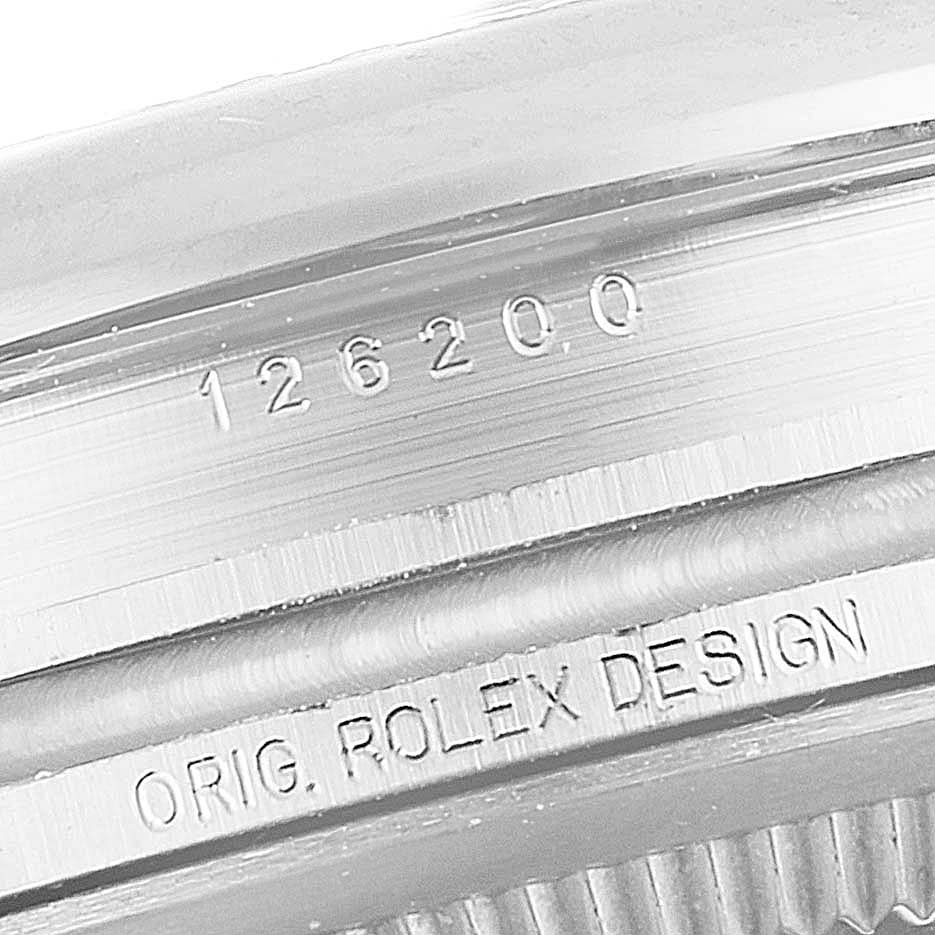 This image shows a close-up of the case side of the Rolex Datejust 126200 Men's Stainless Steel Silver Dial 126200 Men's Stainless Steel Silver Dial, displaying the model number "126200" and "ORIG. ROLEX DESIGN."