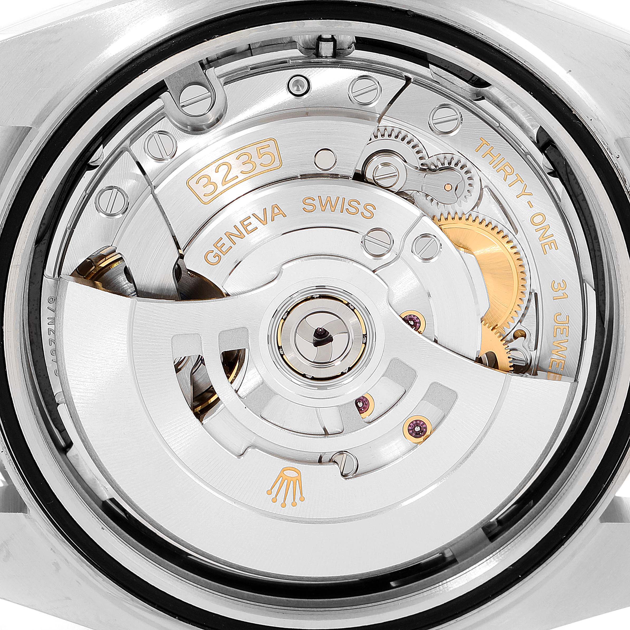 This image shows the Rolex Datejust 41 126300 Men's Stainless Steel Black Dial 126300 Men's Stainless Steel Black Dial watch from the back, revealing its intricate movement and components.