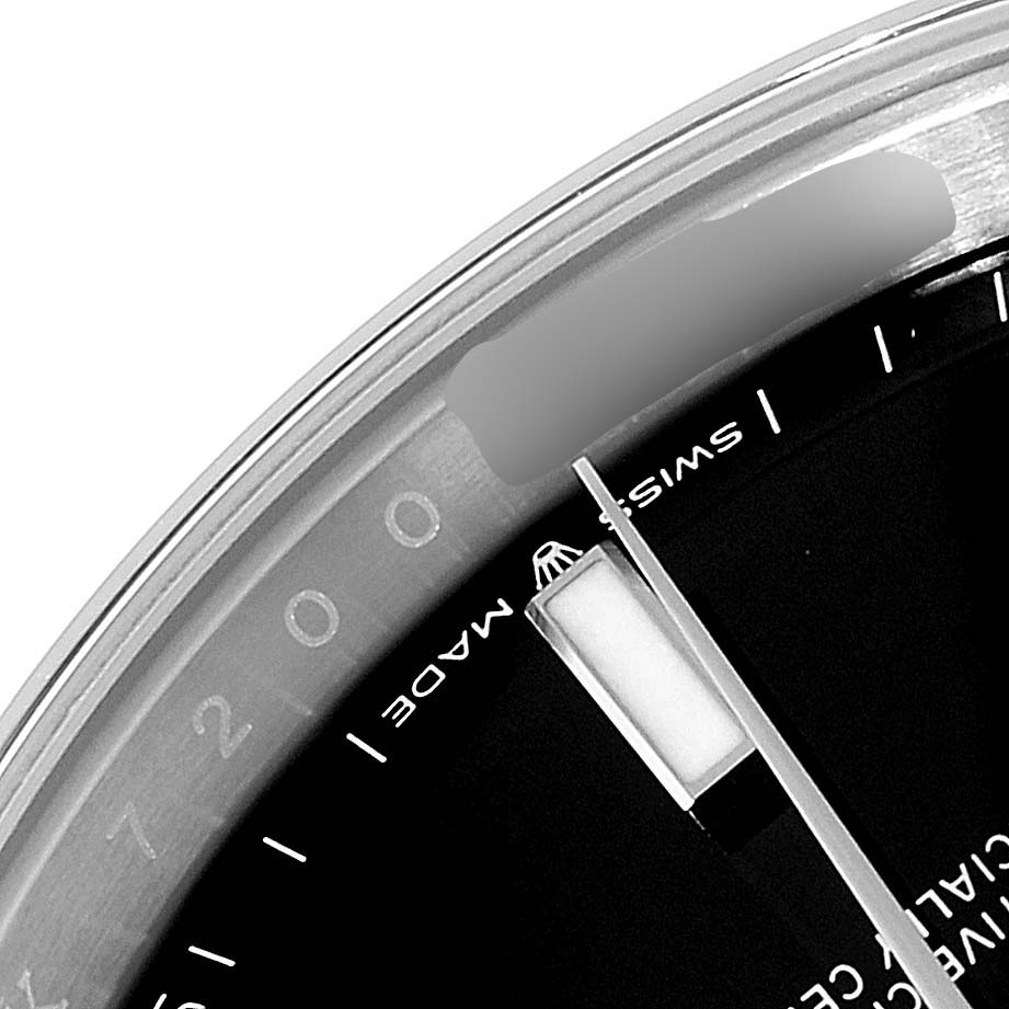 The image shows a close-up of the dial and crystal edge of a Rolex Datejust 41 126300 Men's Stainless Steel Black Dial 126300 Men's Stainless Steel Black Dial, focusing on the hour marker and "SWISS MADE" text.