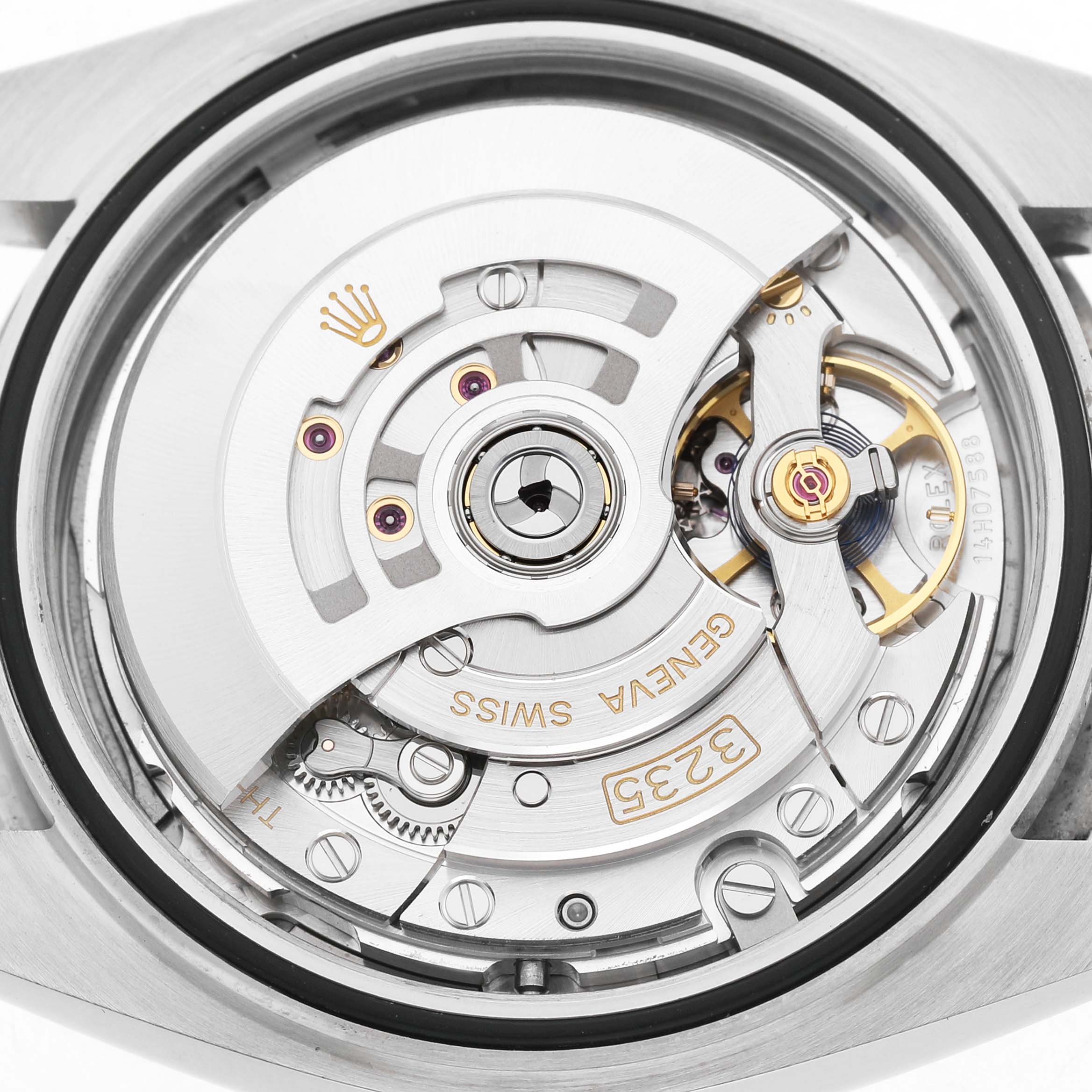 The image shows the movement of the Rolex Datejust 41 126334 Men's Stainless Steel Blue Dial watch, highlighting the rotor and intricate internal components.