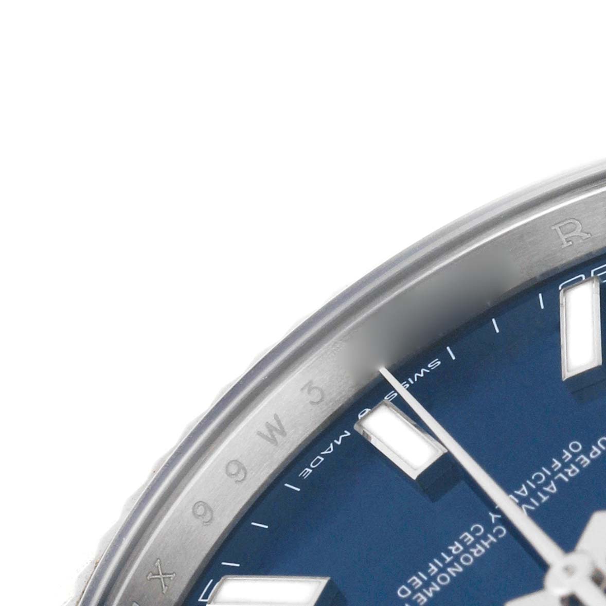 The image shows a close-up of the dial and bezel of a Rolex Datejust 41 126334 Men's Stainless Steel Blue Dial, highlighting part of the hour markers and text.
