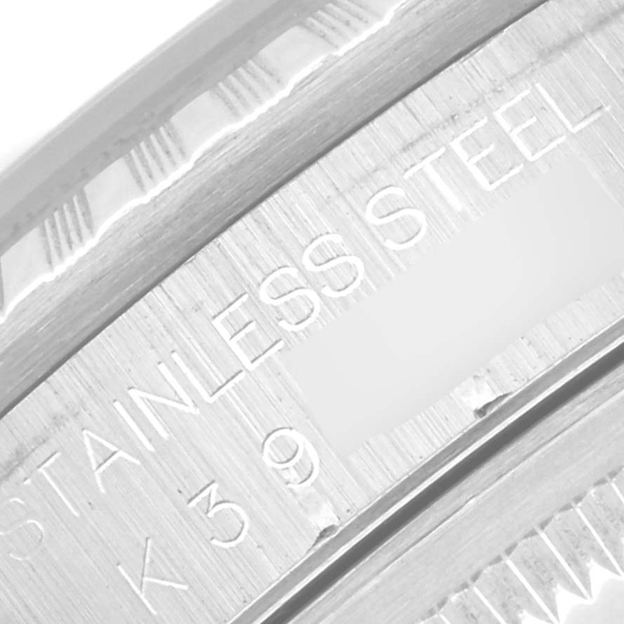 This image shows a close-up of the inner engraving on the bezel of a Rolex Datejust 16220 Men's Stainless Steel Blue Dial 16220 Men's Stainless Steel Blue Dial model, indicating "STAINLESS STEEL."
