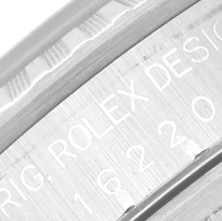 The image shows a close-up angle of the inner ring and engraved text on the Datejust model by Rolex.